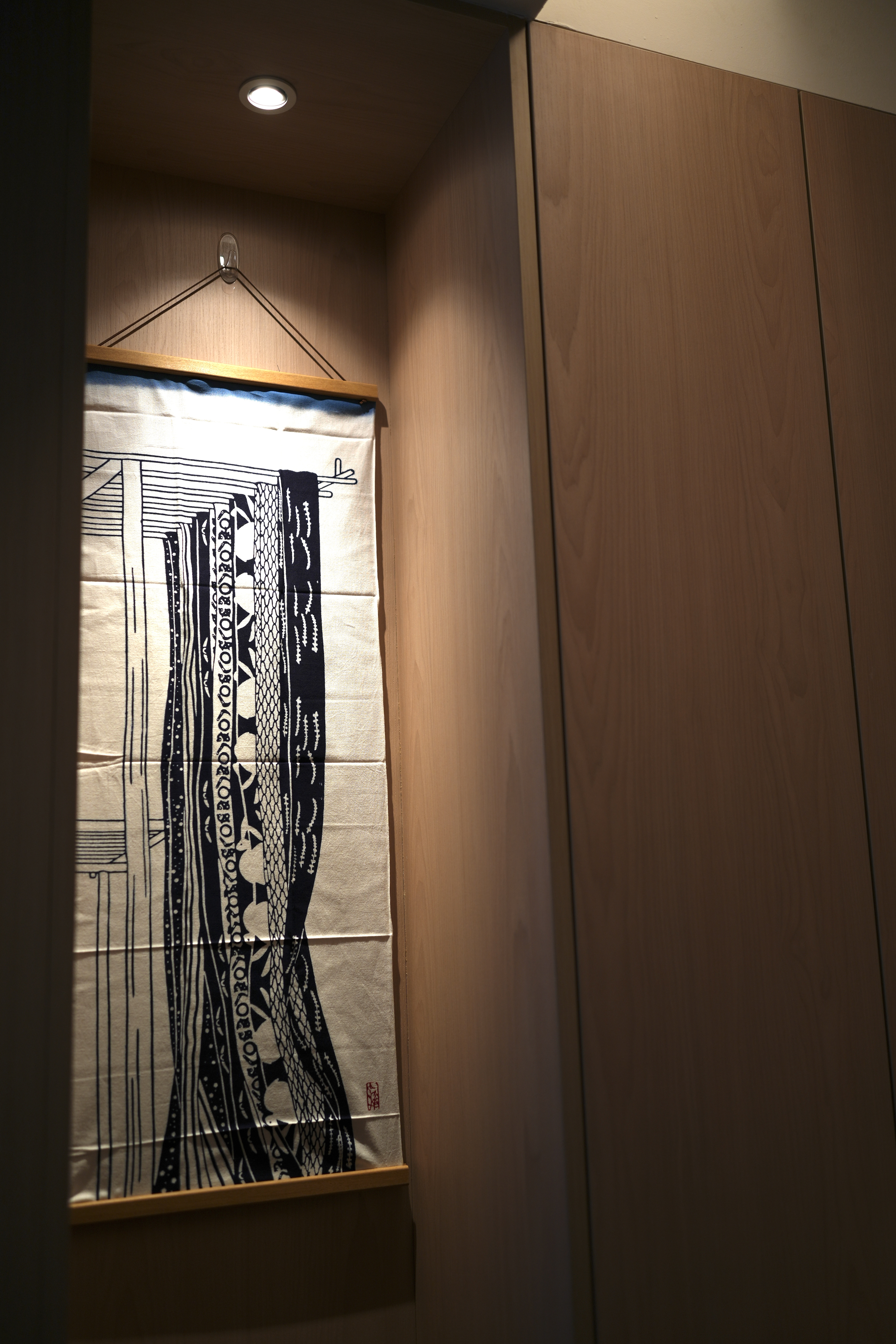 Choosing Lighting: Dimmables, Accents, Moods - Wooden wardrobe interior, hanging fabric, black and white design, traditional