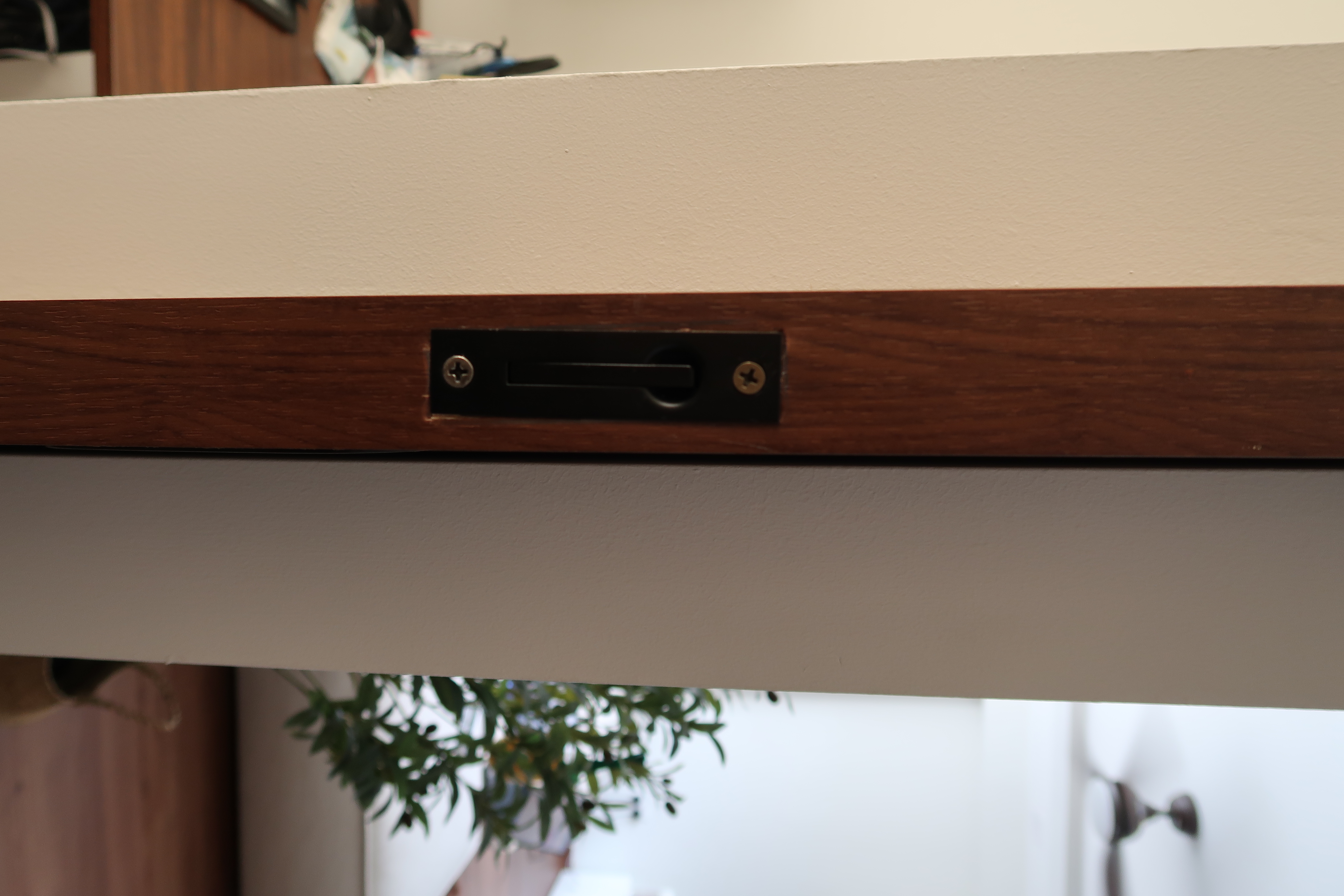 Workspace: We hacked our room into half  - Wooden drawer handle, metal lock, wooden frame, white wall, indoor setting, indoor