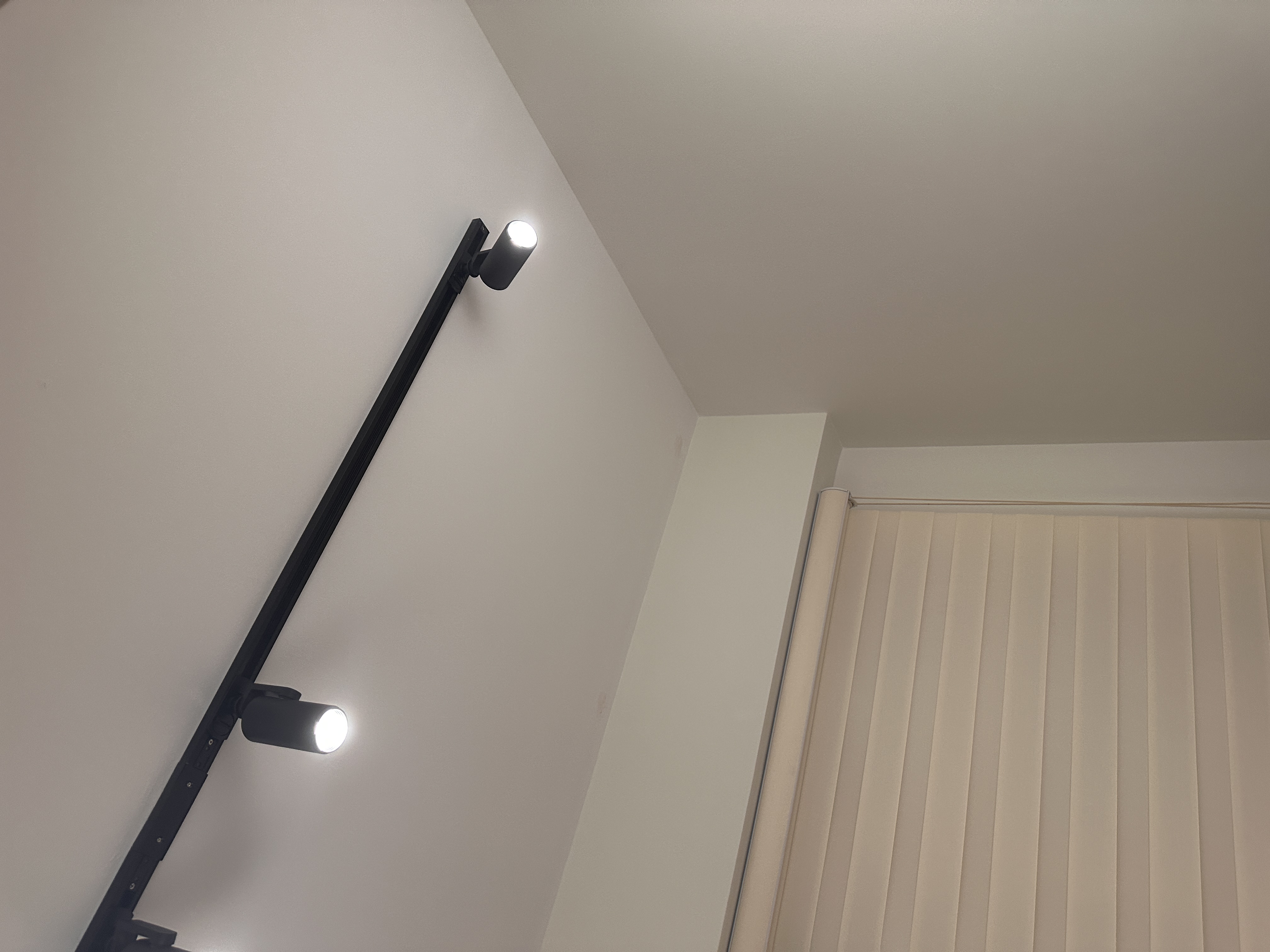 Workspace: We hacked our room into half  - Modern minimalist wall-mounted light fixture, sleek black design, three