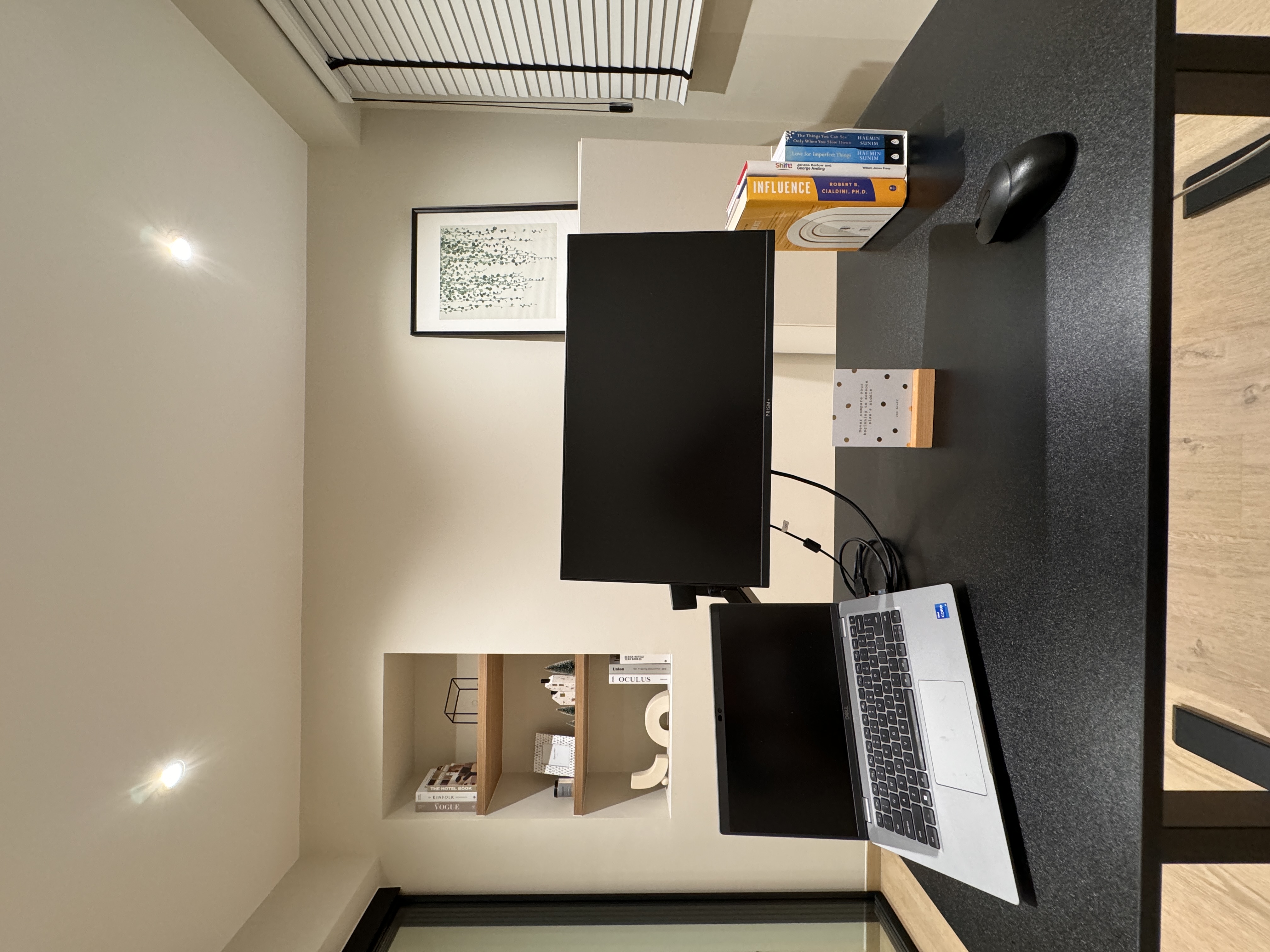 The Art of Remote Work: A Peek into Our Home Workspace - Modern workspace, minimalist decor, sleek monitor, black laptop