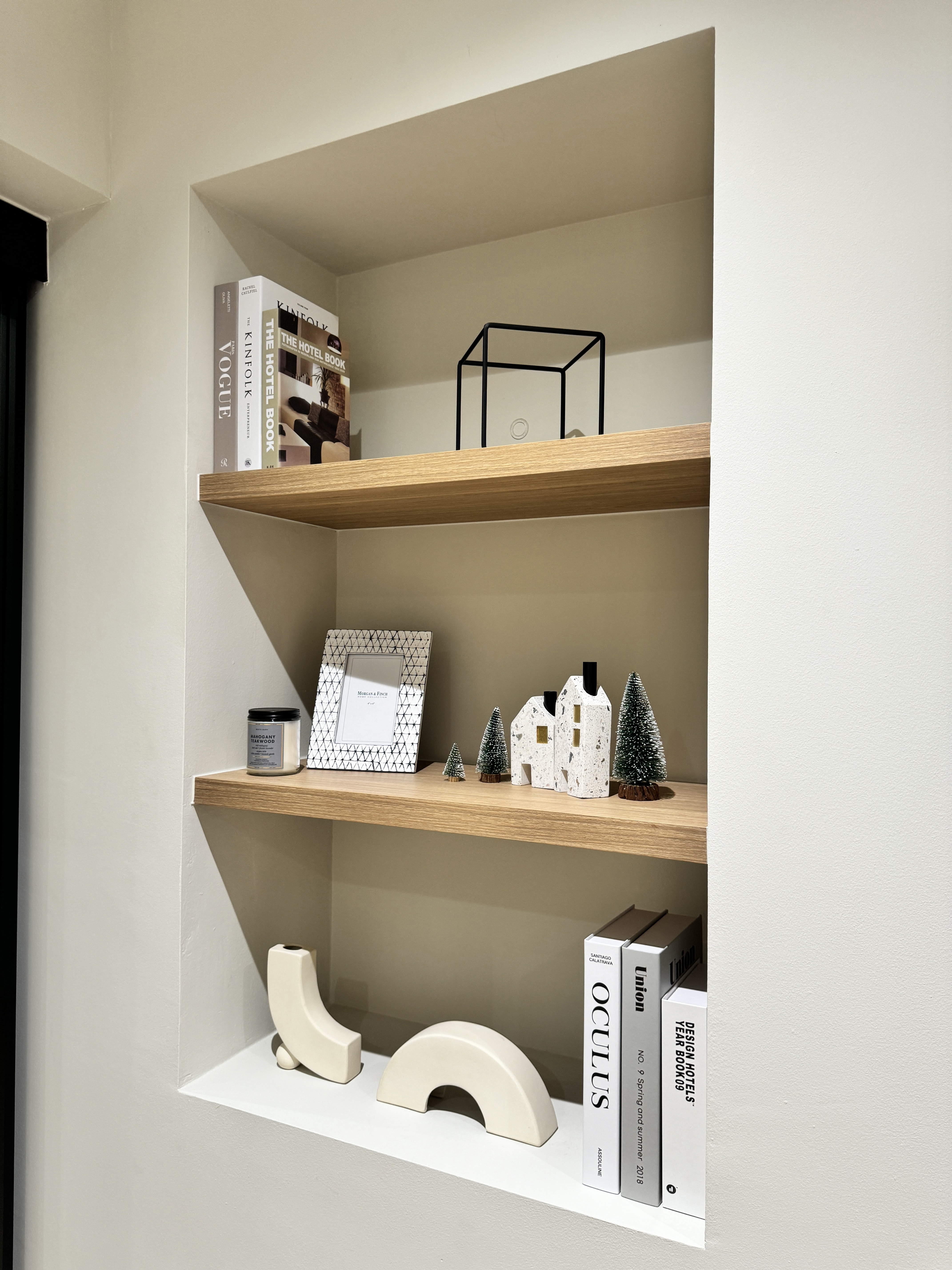 The Art of Remote Work: A Peek into Our Home Workspace - Wooden shelves, minimalist decor, modern art, small house figurines