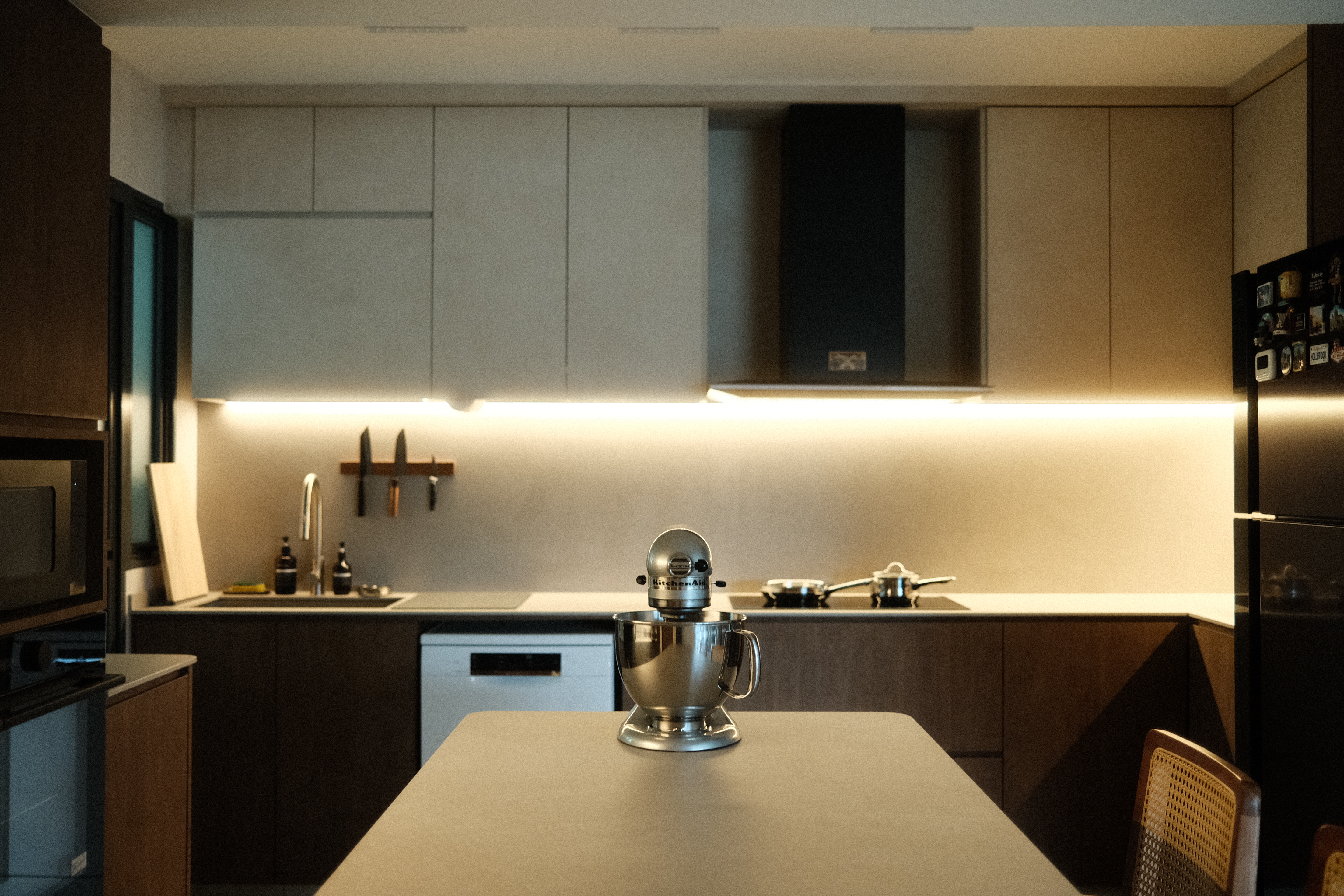 Building the kitchen island of our dreams - Modern kitchen with sleek cabinets, stainless steel mixer on the countertop