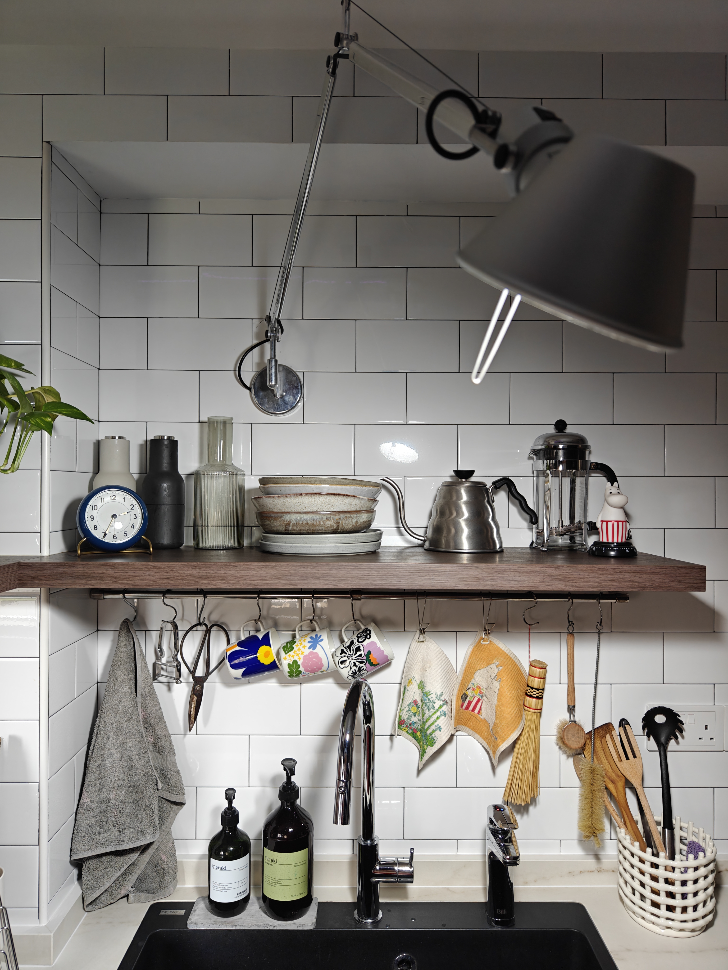 You Light Up My Life! - White tiled kitchen wall, modern kitchen design, hanging towel, stainless steel faucet, black and