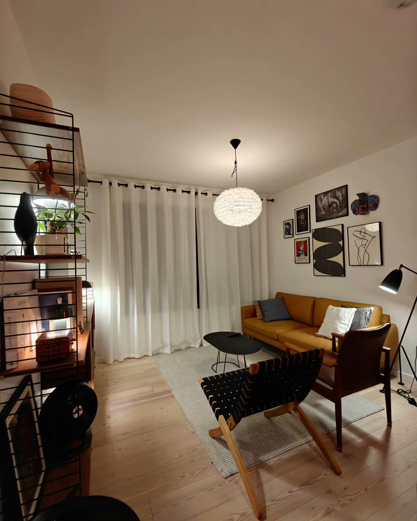 You Light Up My Life! - Modern living room, cozy seating area, wooden floor, white curtains, mustard yellow sofa, black and