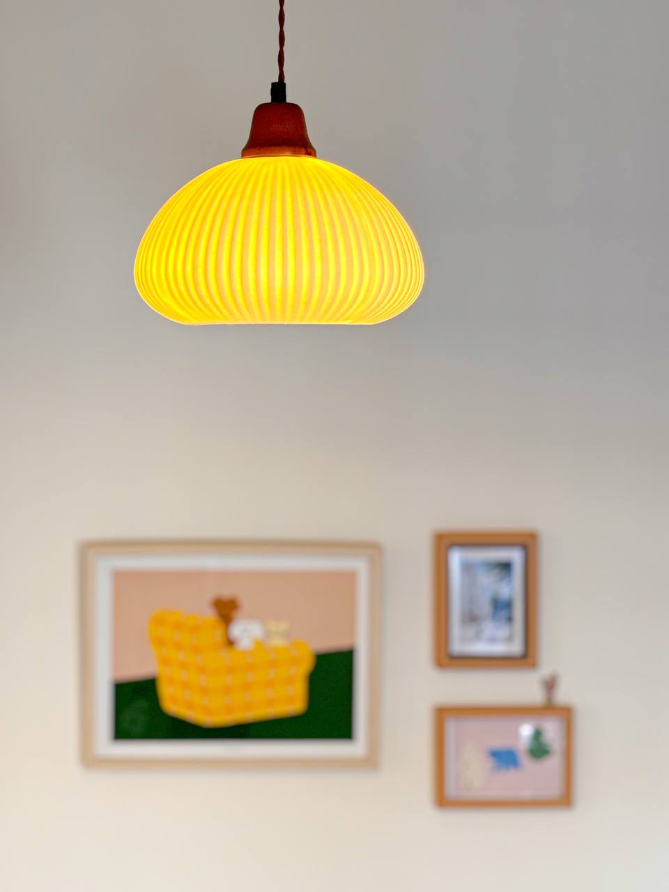 Good Lighting Makes Your House a Home  - Yellow pendant light, modern decor, abstract painting, cozy room, warm ambiance