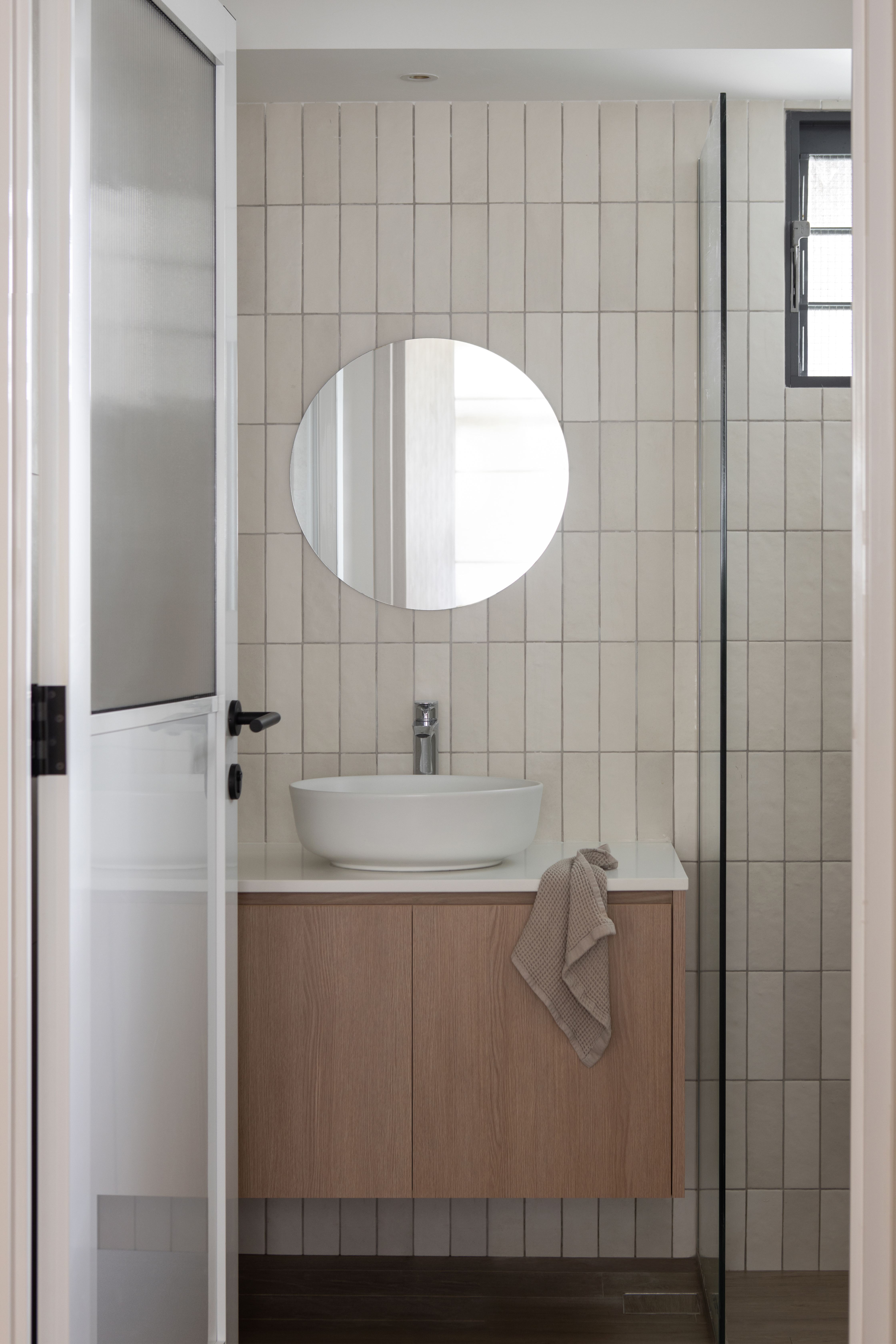 Bathroom: Creating textures through tiles - Modern bathroom interior, minimalist design, white ceramic sink, round mirror