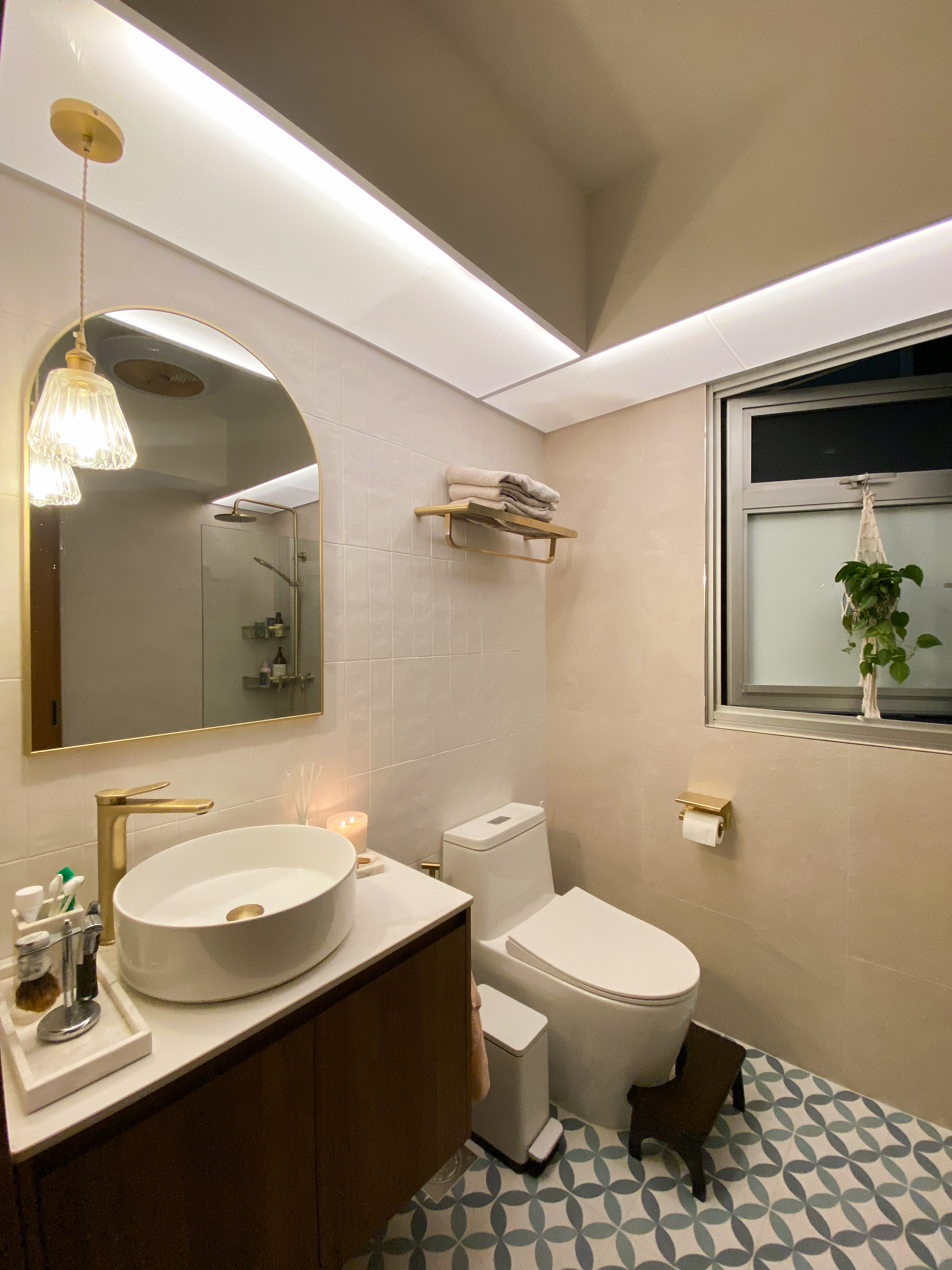 Our vibrant and subtle Mid-Century Modern Boho bathrooms - Modern bathroom with sleek design, large mirror, gold fixtures