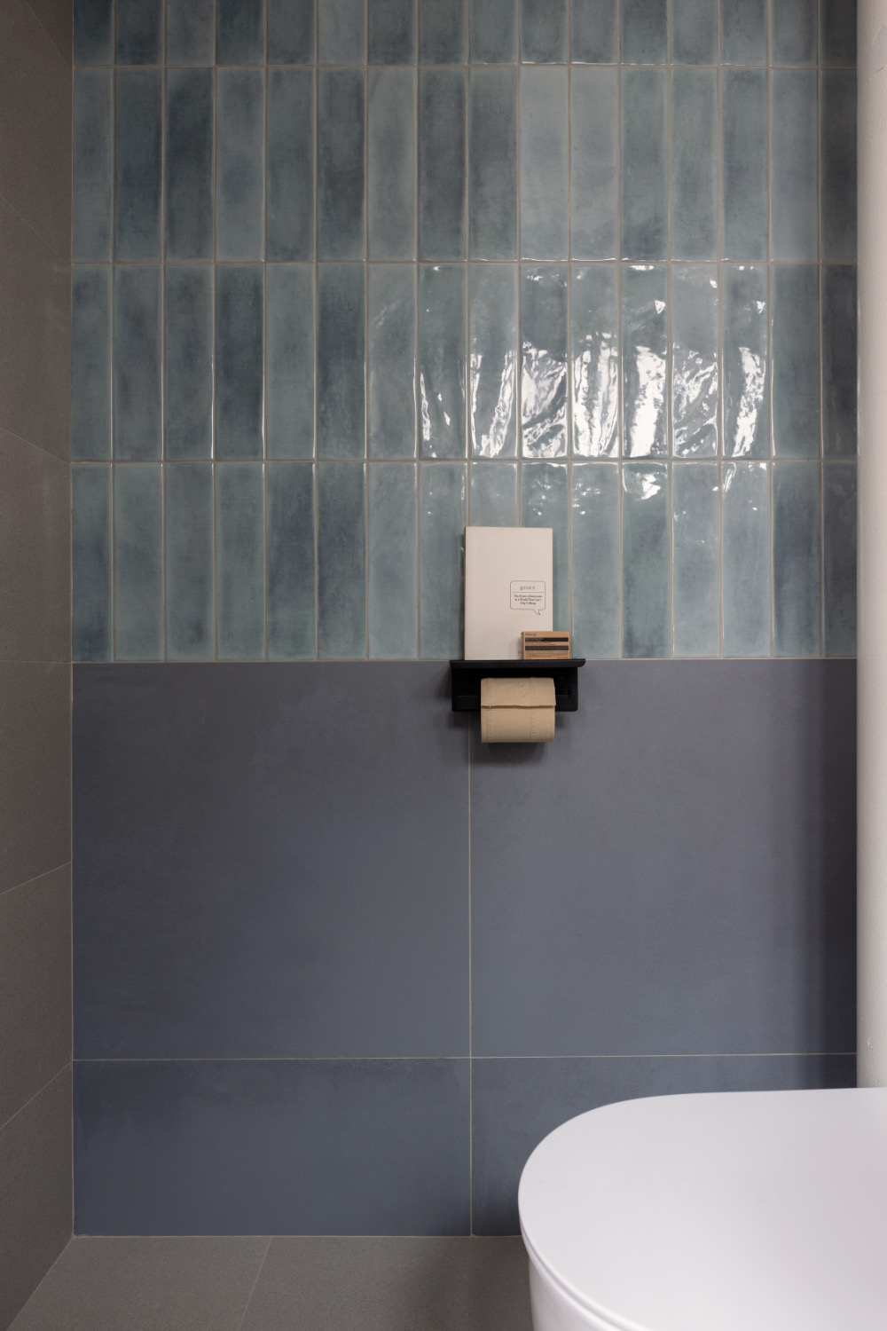 Render vs Reality - Bathrooms and Kitchen - Blue-tiled bathroom wall, minimalist design, gray and blue tiles, modern decor