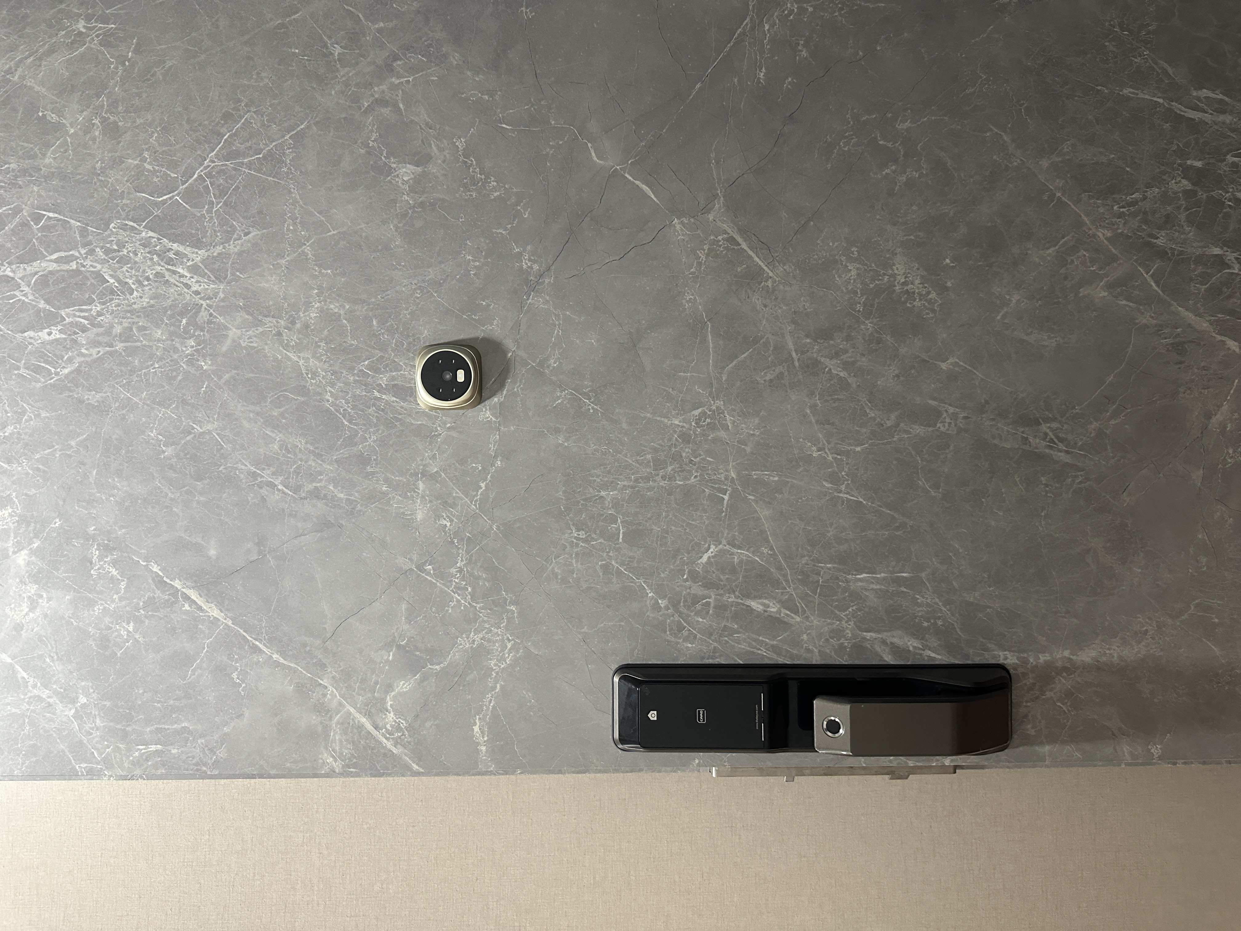 Entryway: Functional and well thought walkway into our home  - Grey marble surface, black device, sleek design, modern decor