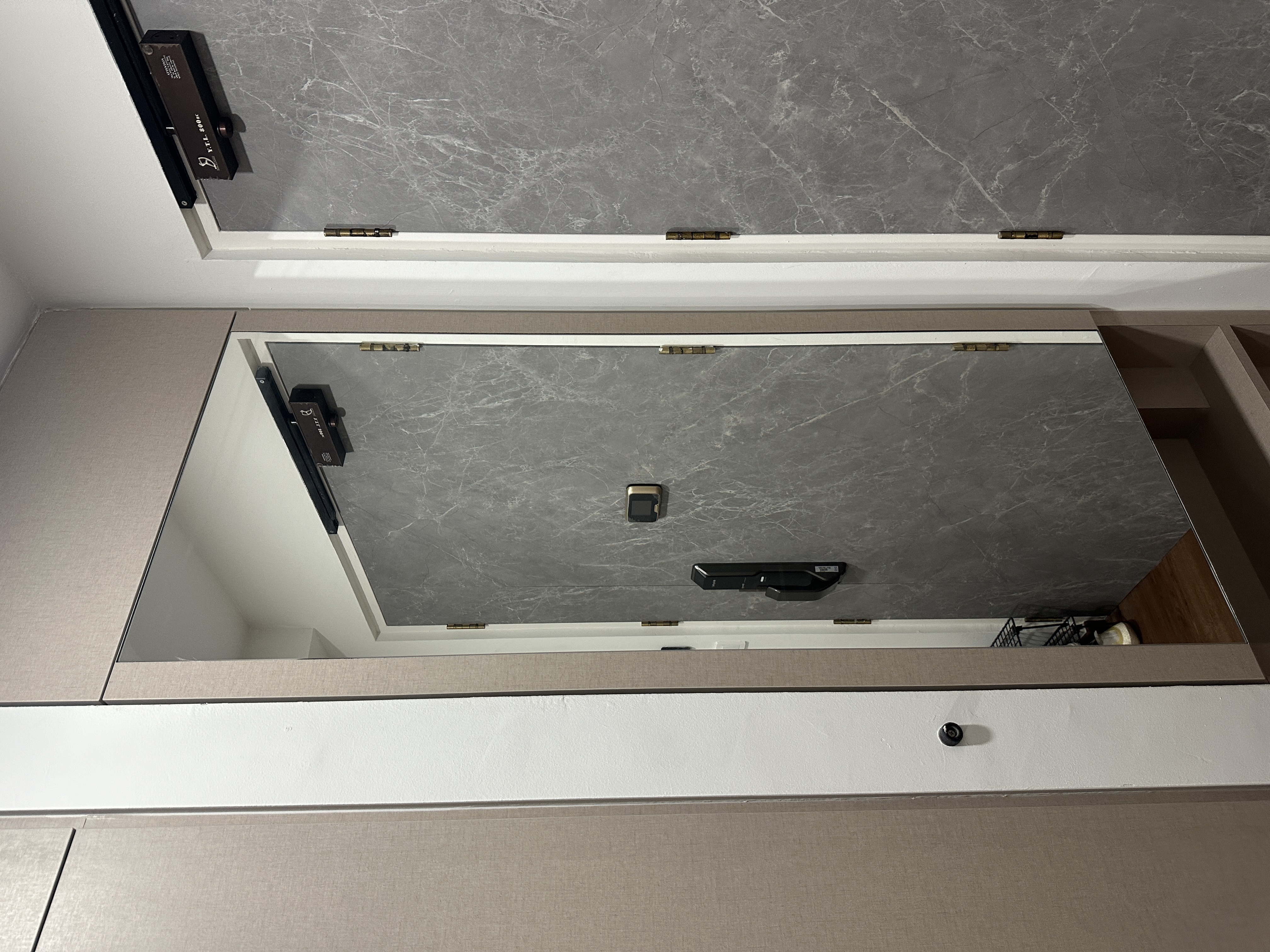 Entryway: Functional and well thought walkway into our home  - Grey marble countertop, modern design, sleek handles, built-in