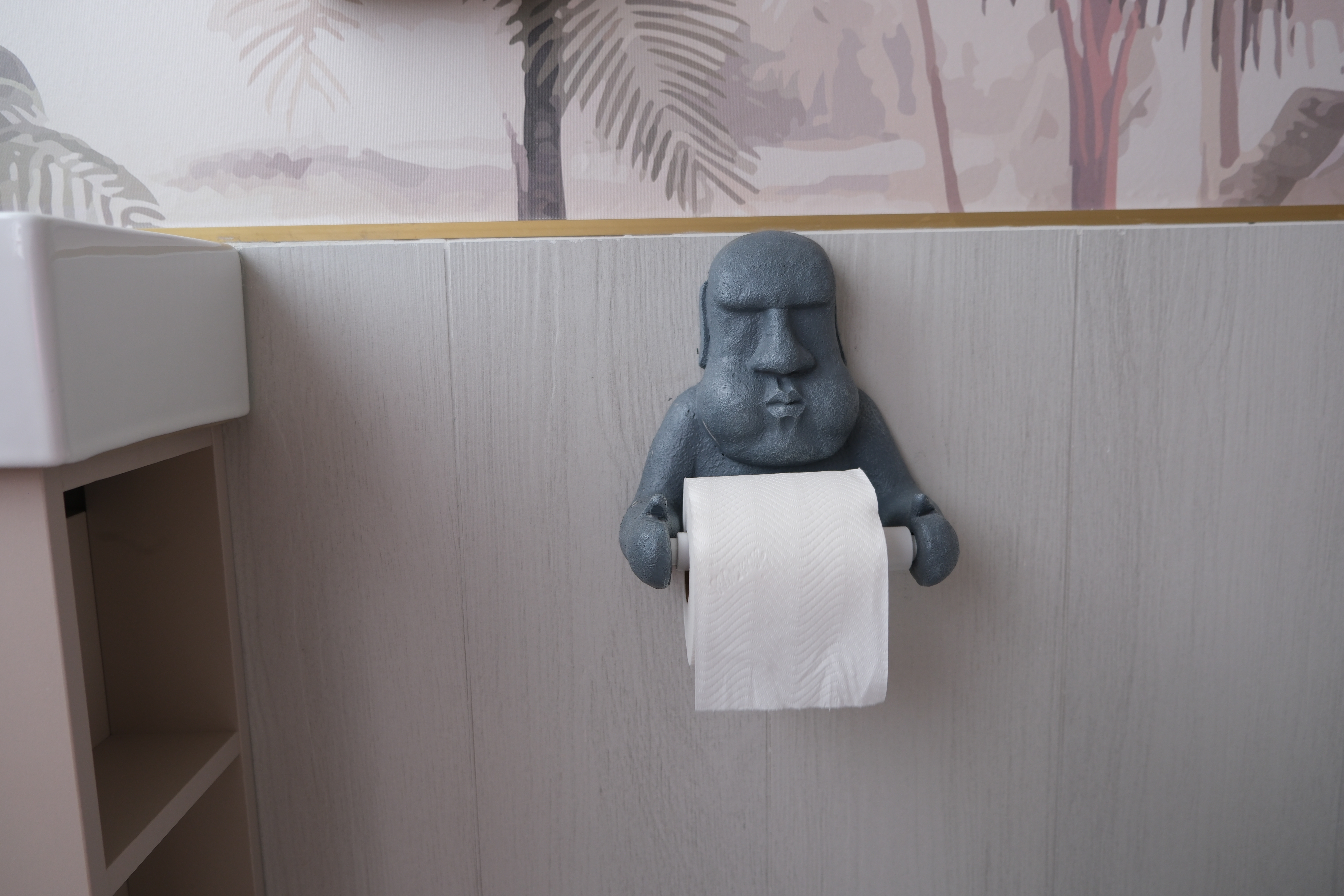 A Botanical Paradise at our Common Toilet - Bathroom, toilet paper holder, blue statue, toilet paper roll, wall-mounted