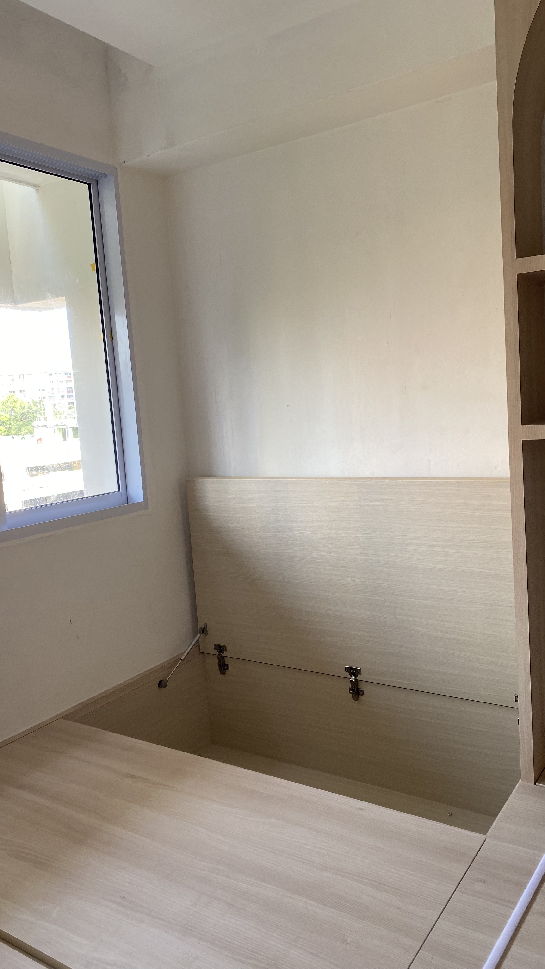 Playing hide and seek with the tofus 👀 - Minimalist room with light beige walls, wooden floor, large window with white