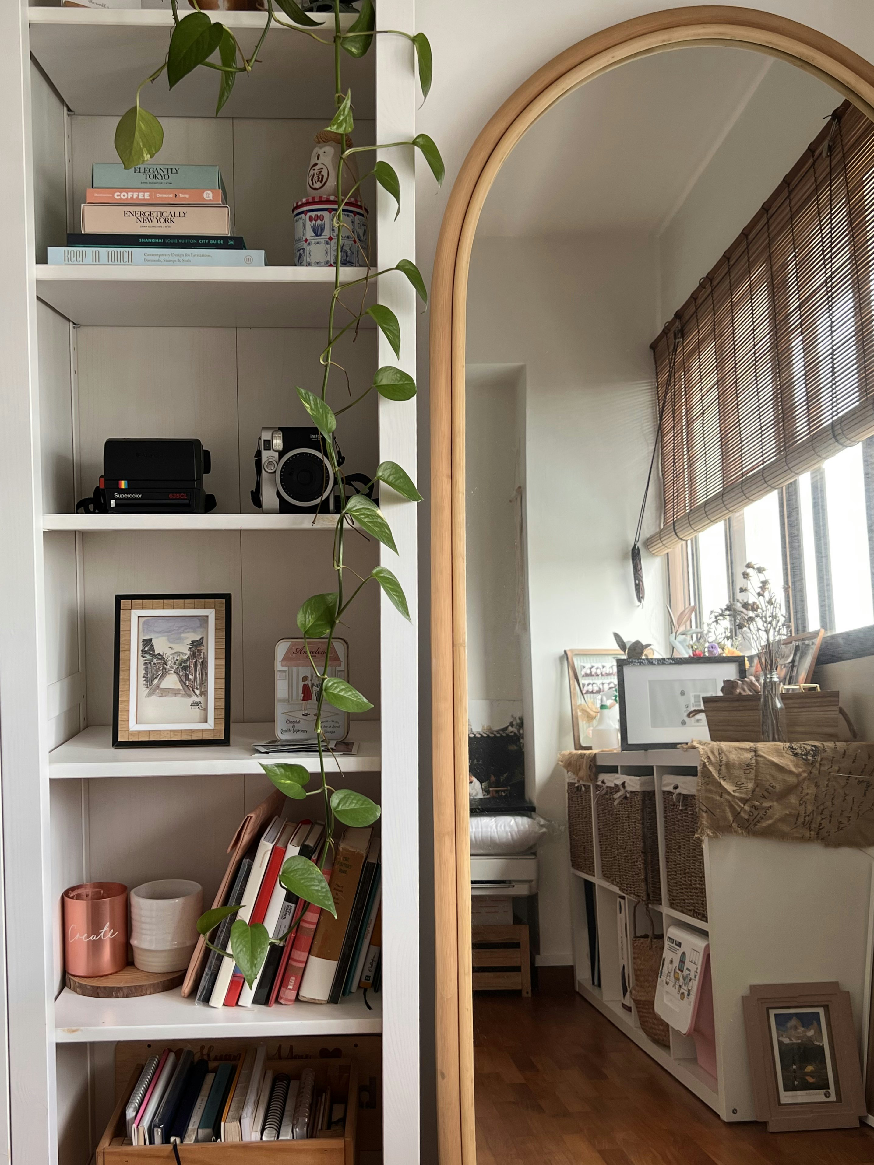 Travel-inspired Farmhouse Study Room with Loose Furnishings - White bookshelf, indoor setting, cozy atmosphere, natural