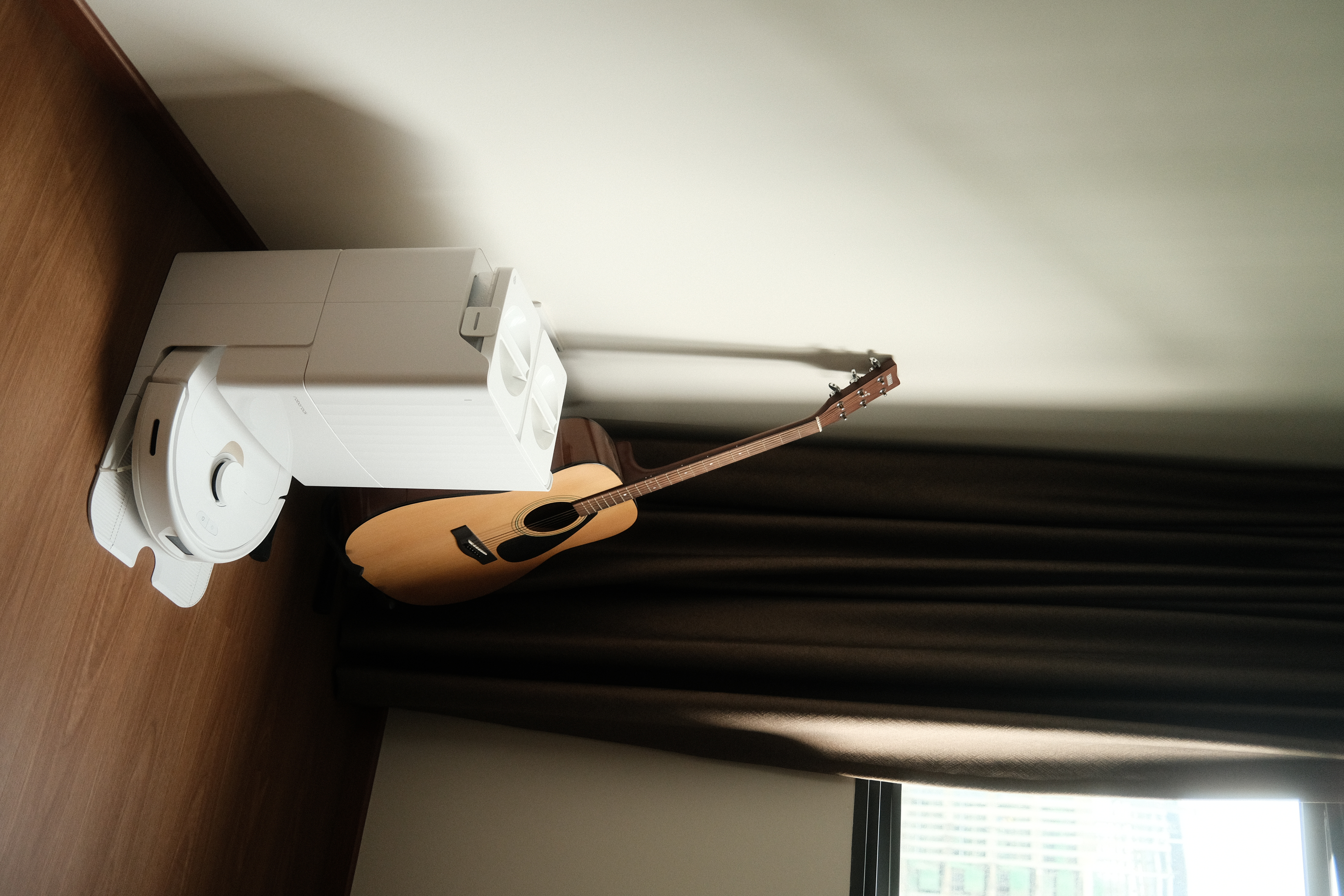 Our simple and minimal workspace - White robotic vacuum cleaner, acoustic foam floor mat, wooden floor, modern interior
