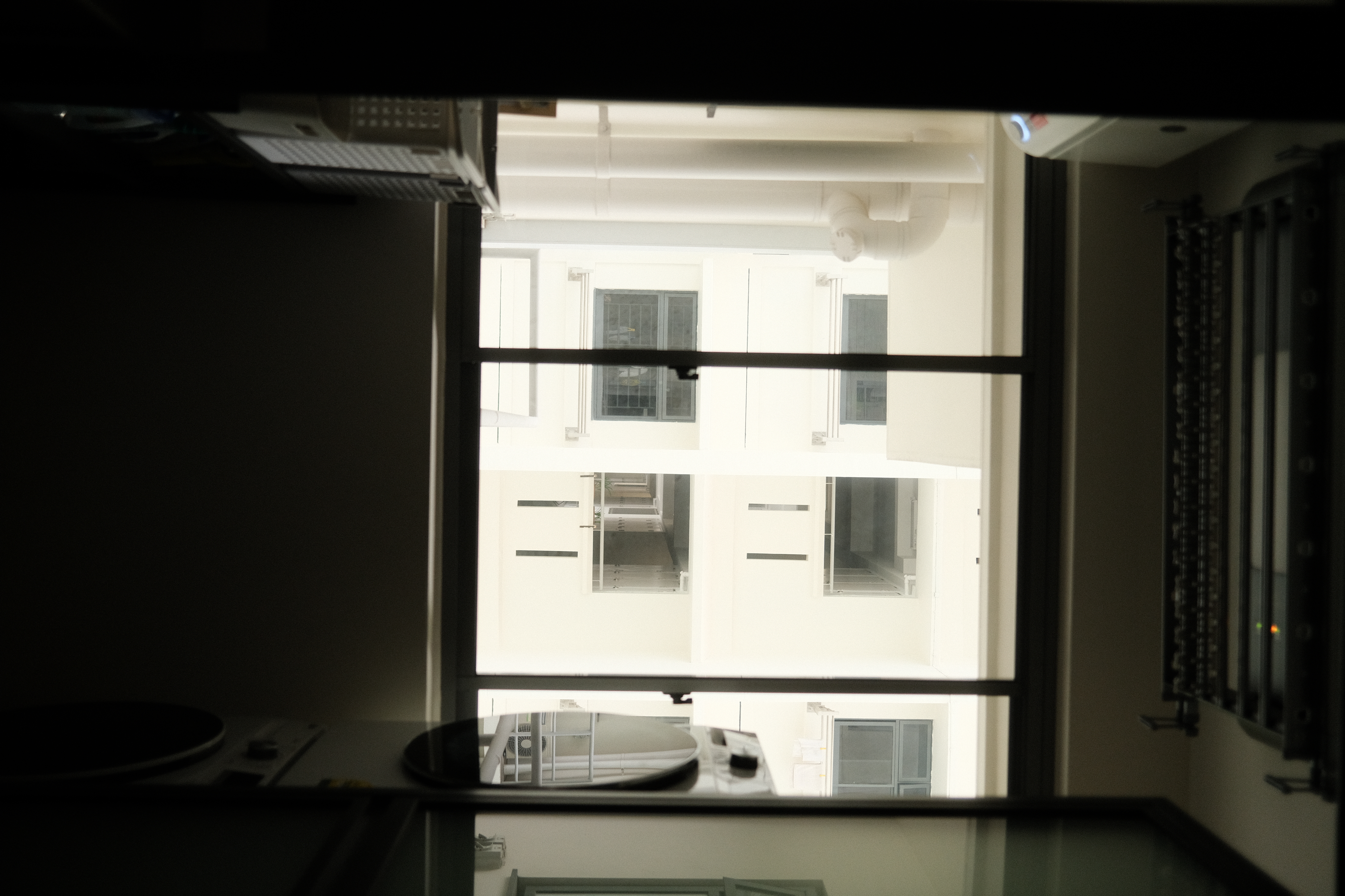 Organising our service yard - Modern kitchen interior, large window, bright daylight, minimalist design, industrial elements