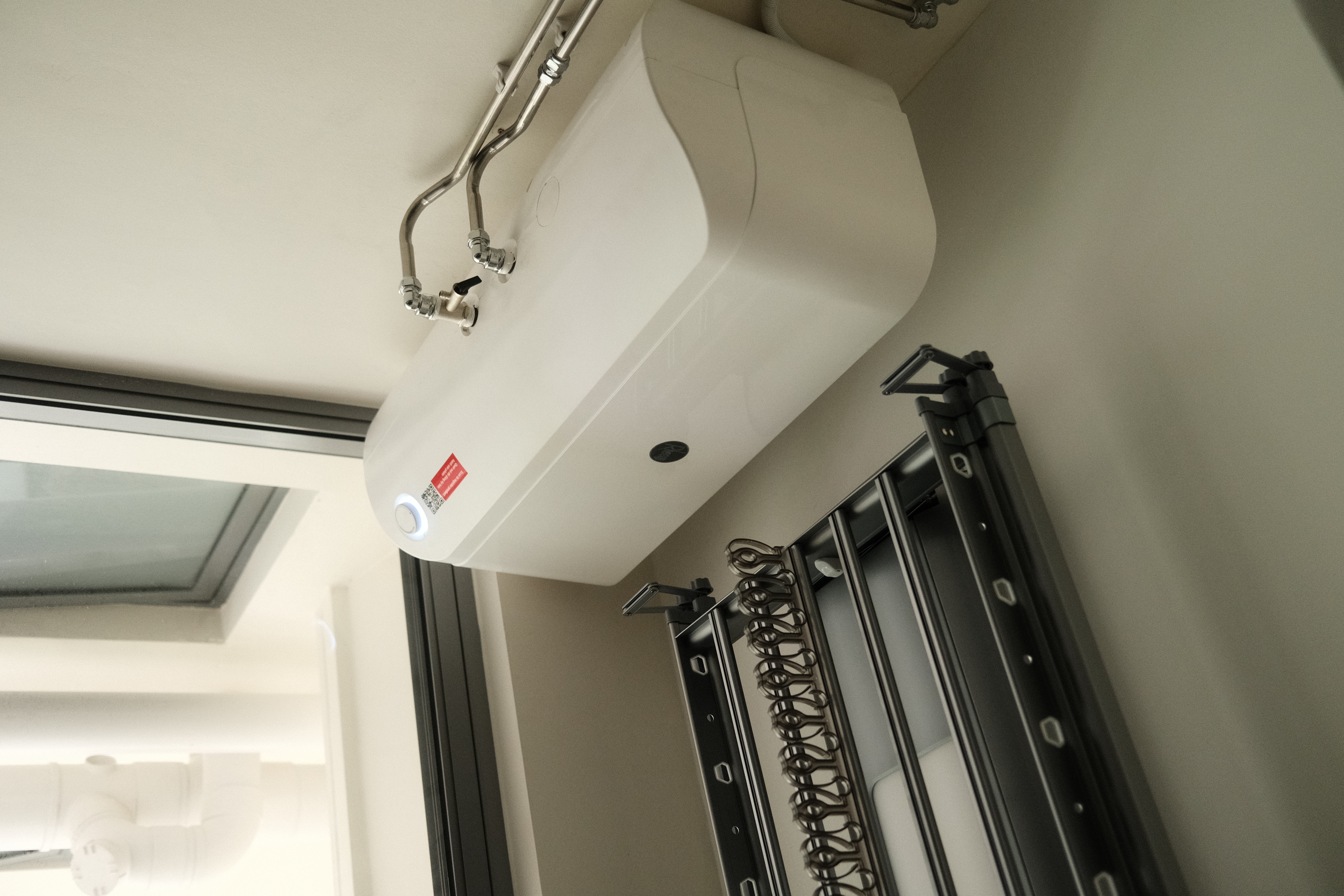 Organising our service yard - Air conditioning unit, wall-mounted, modern design, white color, control panel, ventilation