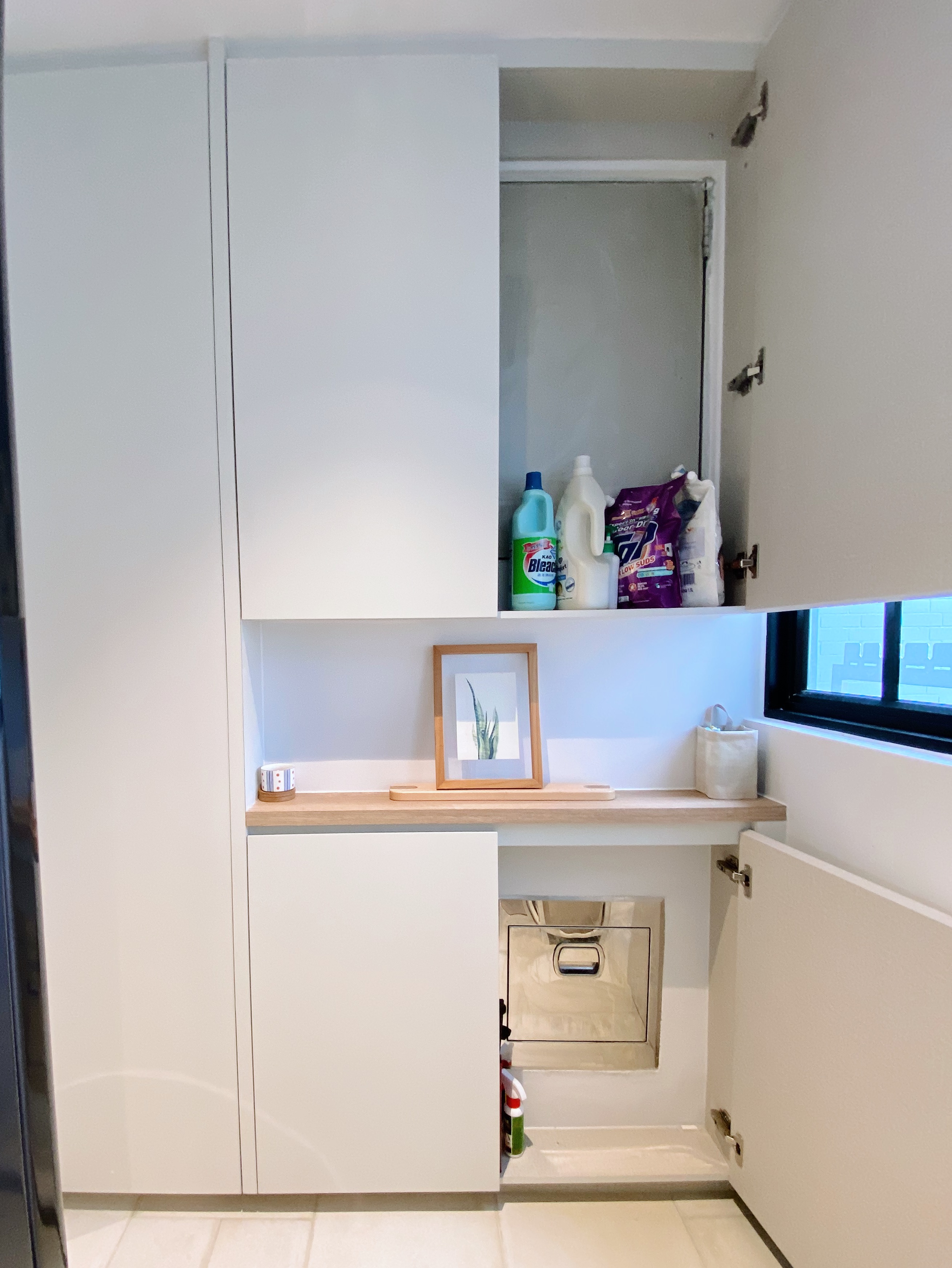 Spoilt by the service yard experience - White kitchen cabinets, open shelf, cleaning supplies, detergent, bleach, paper