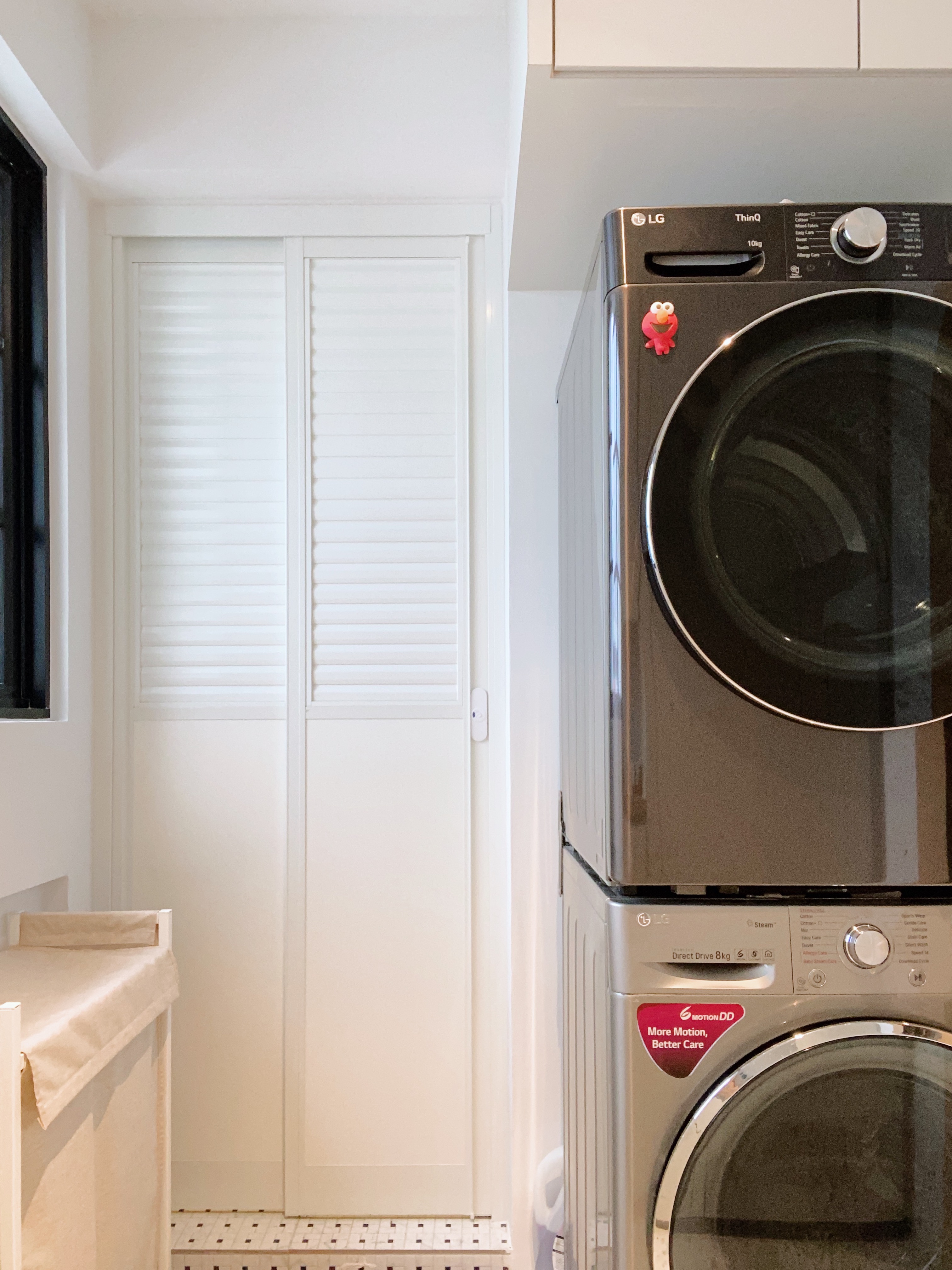 Spoilt by the service yard experience - Modern laundry room with sleek LG washing machine, Stainless steel LG washing machine