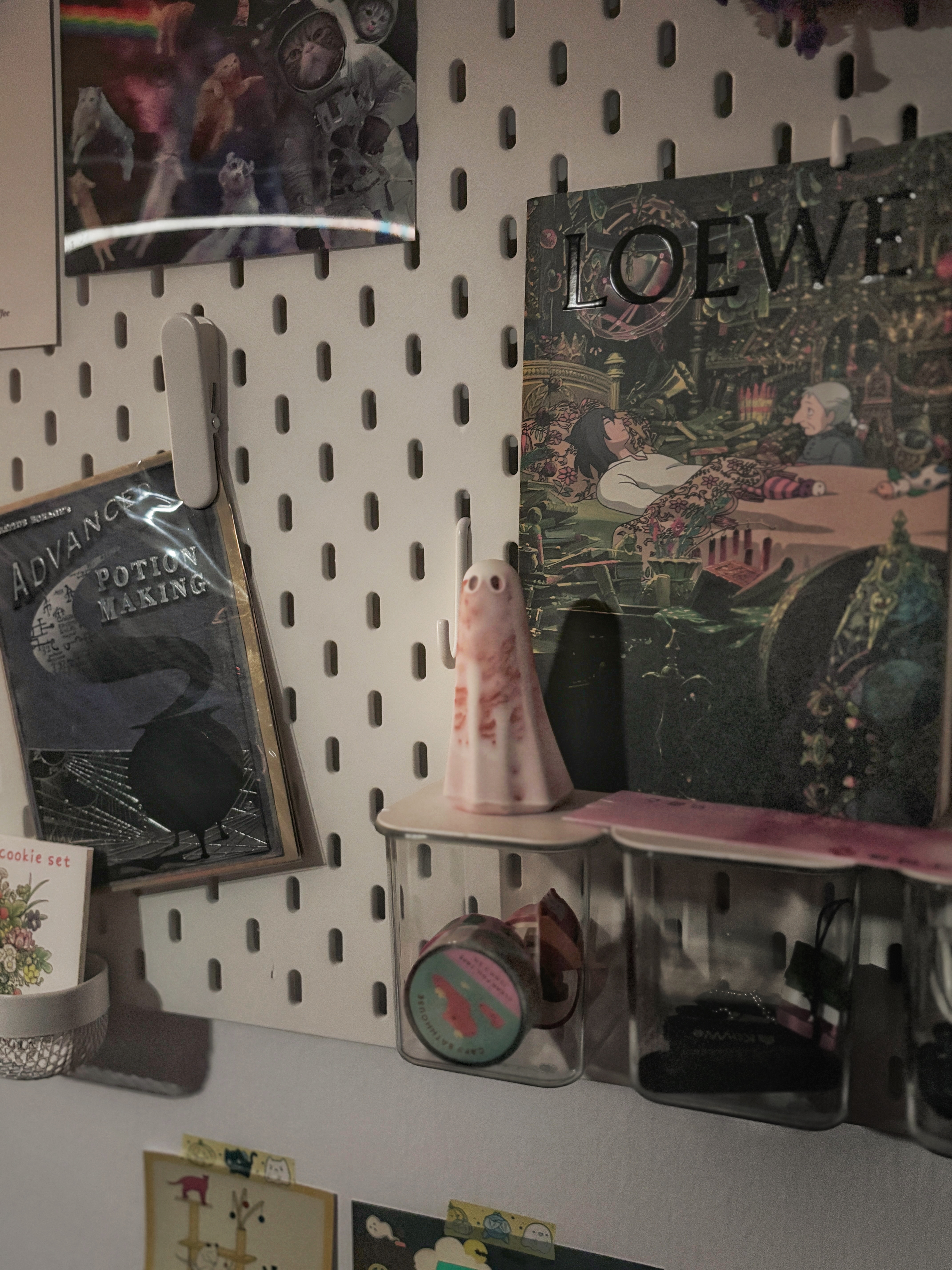 Our House is Full of Ghosts 👻 - "Sci-Fi-themed wall decor, featuring a cat in an astronaut suit and a potion-making book"