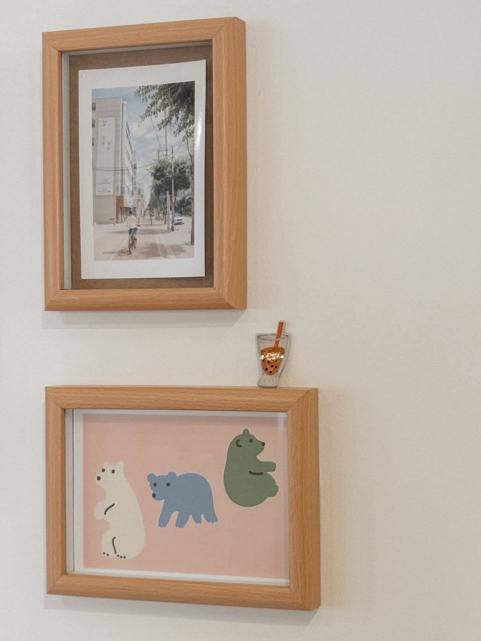 The Art in Our Home - Wooden framed photograph of a city street scene, Illustration of a cyclist on a tree-lined street