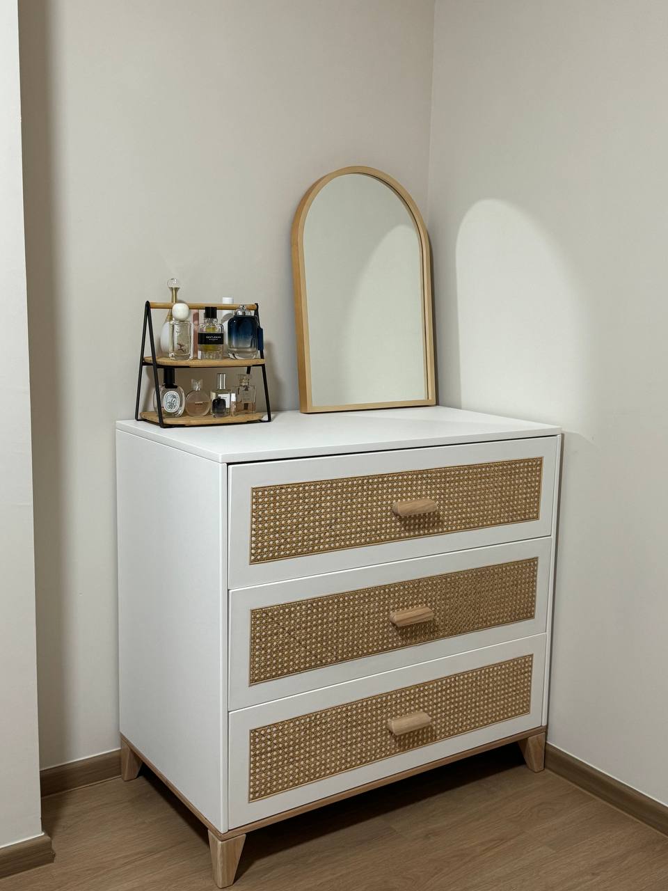 Extra Room: Rattan inspired - White vanity with woven handles, wooden legs, built-in mirror, wooden tray with bottles