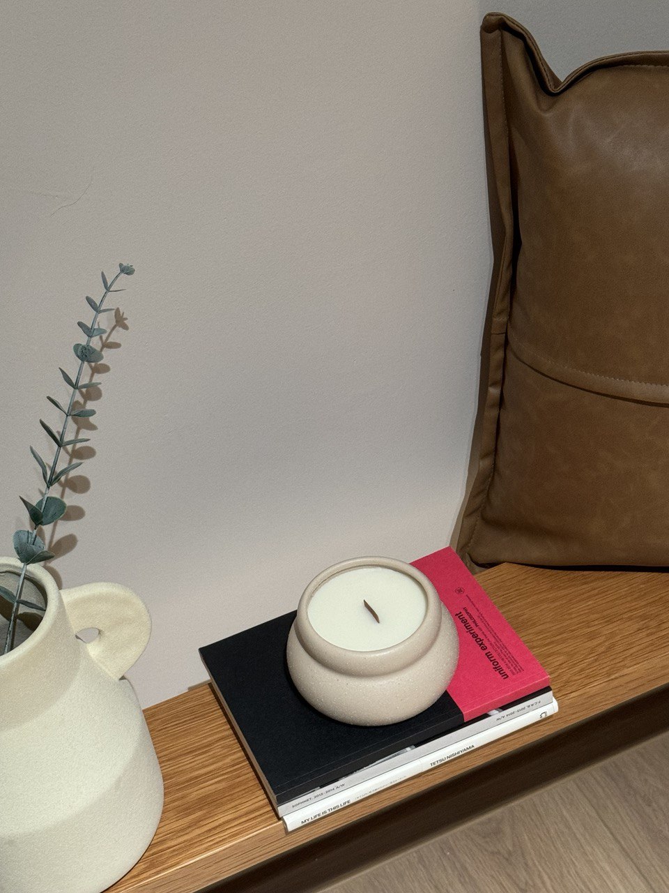 Entryway: Welcoming look - Candle, wooden shelf, minimalist design, modern decor, cozy atmosphere, soft lighting, natural