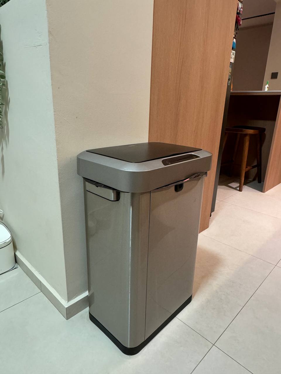 Service Yard: Our pet's corner - Grey trash can, modern design, sleek surface, closed lid, integrated control panel