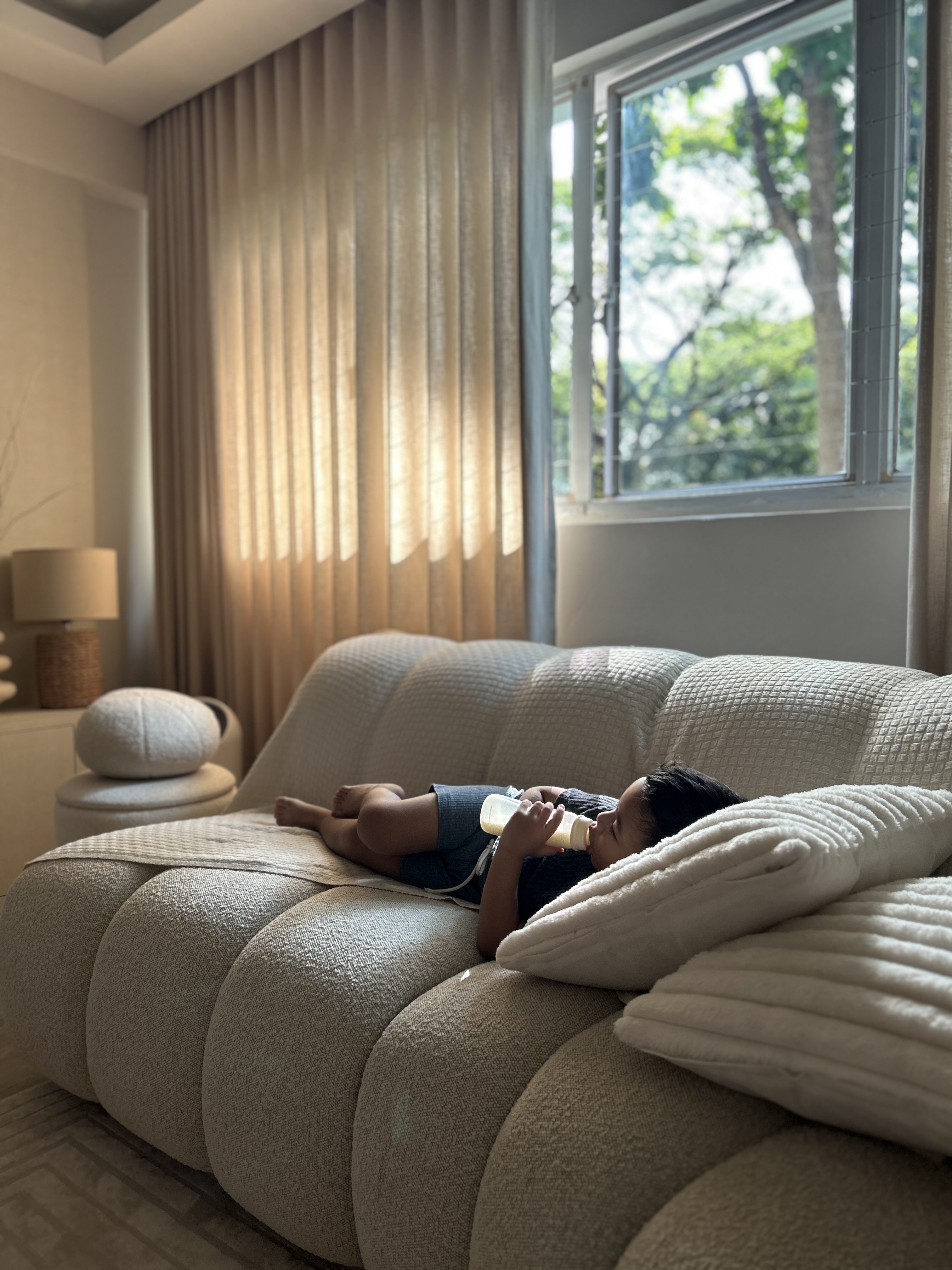 Guess our Favourite Spot to chill? - Soft, beige, modern living room, cozy atmosphere, child lying on sofa, breastfeeding