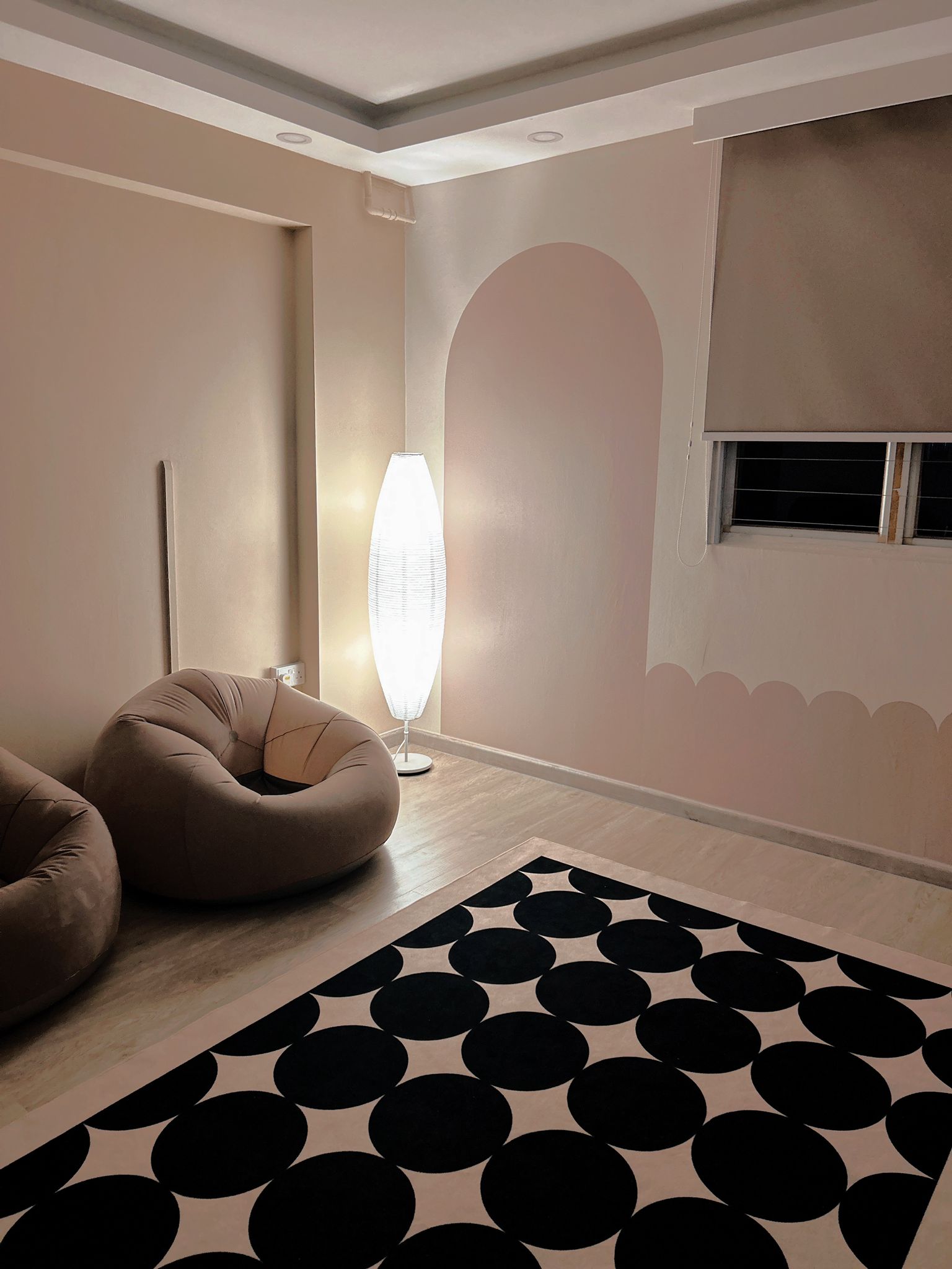 From Bedroom to Entertainment room - Modern minimalist living room, cozy seating area, soft beige walls, abstract art design