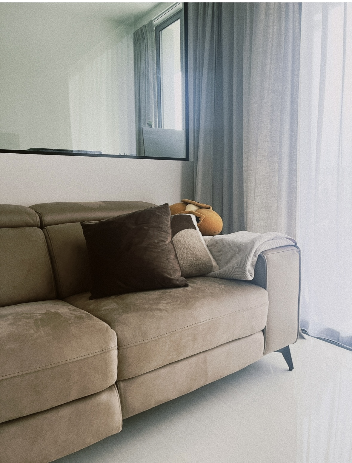Still very much a WIP, our little living area! - Modern living room, cozy sofa, neutral color palette, plush cushions, soft