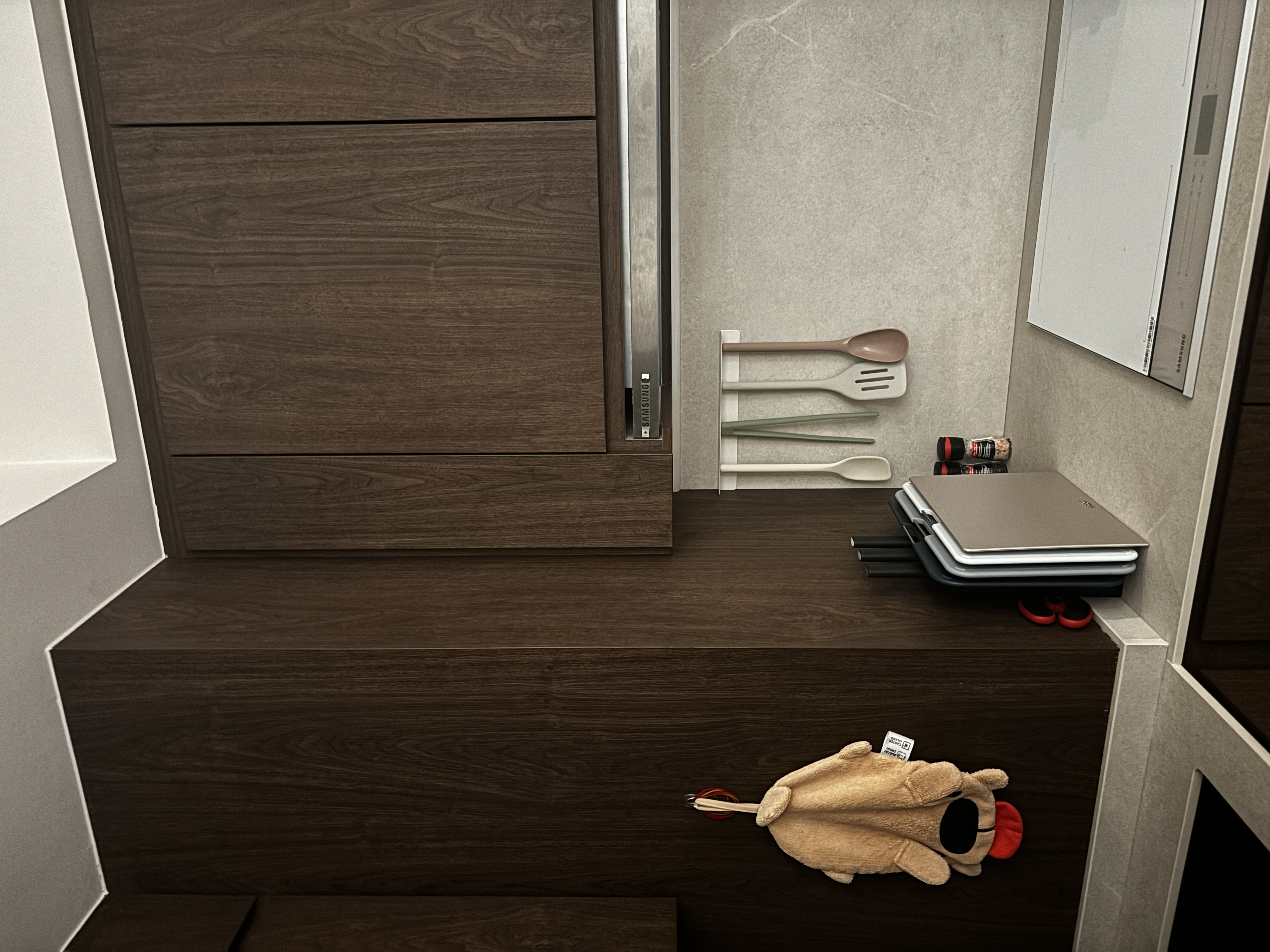 Small add-ons, big difference! - Wooden staircase, brown wooden door, neatly organized kitchen utensils, beige plush toy