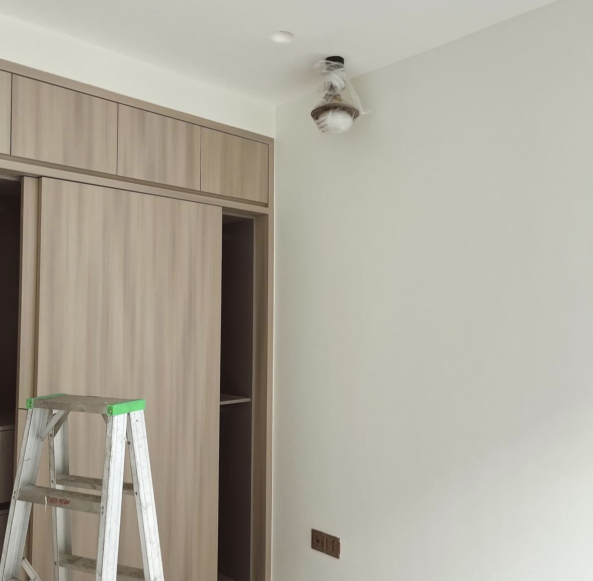 Small add-ons, big difference! - Wooden cabinet, ladder, interior wall, light switch, ceiling fan, exposed wires, unfinished