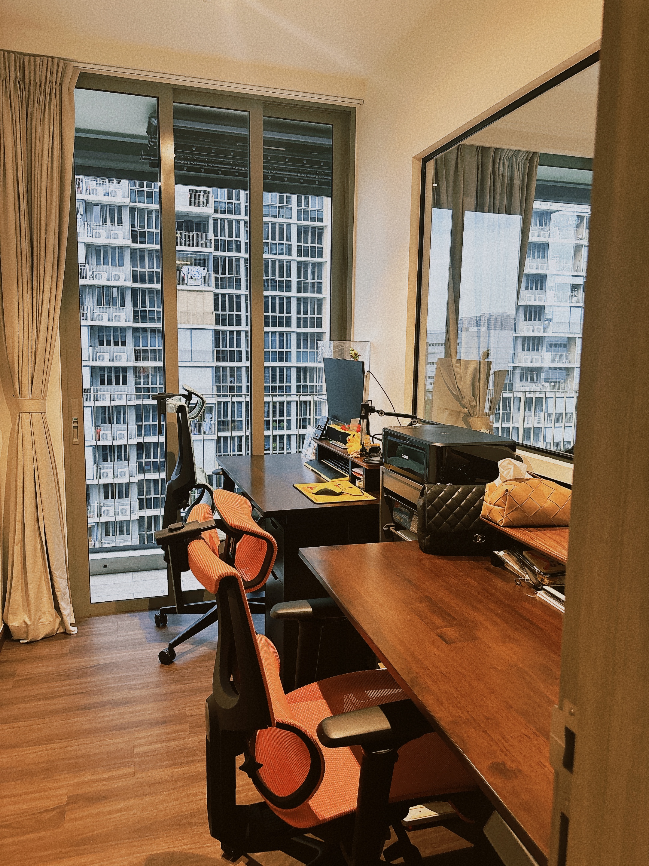 HIS / HERS Work desk! - Modern office space, large windows, beige curtains, wooden floor, ergonomic office chair, black and