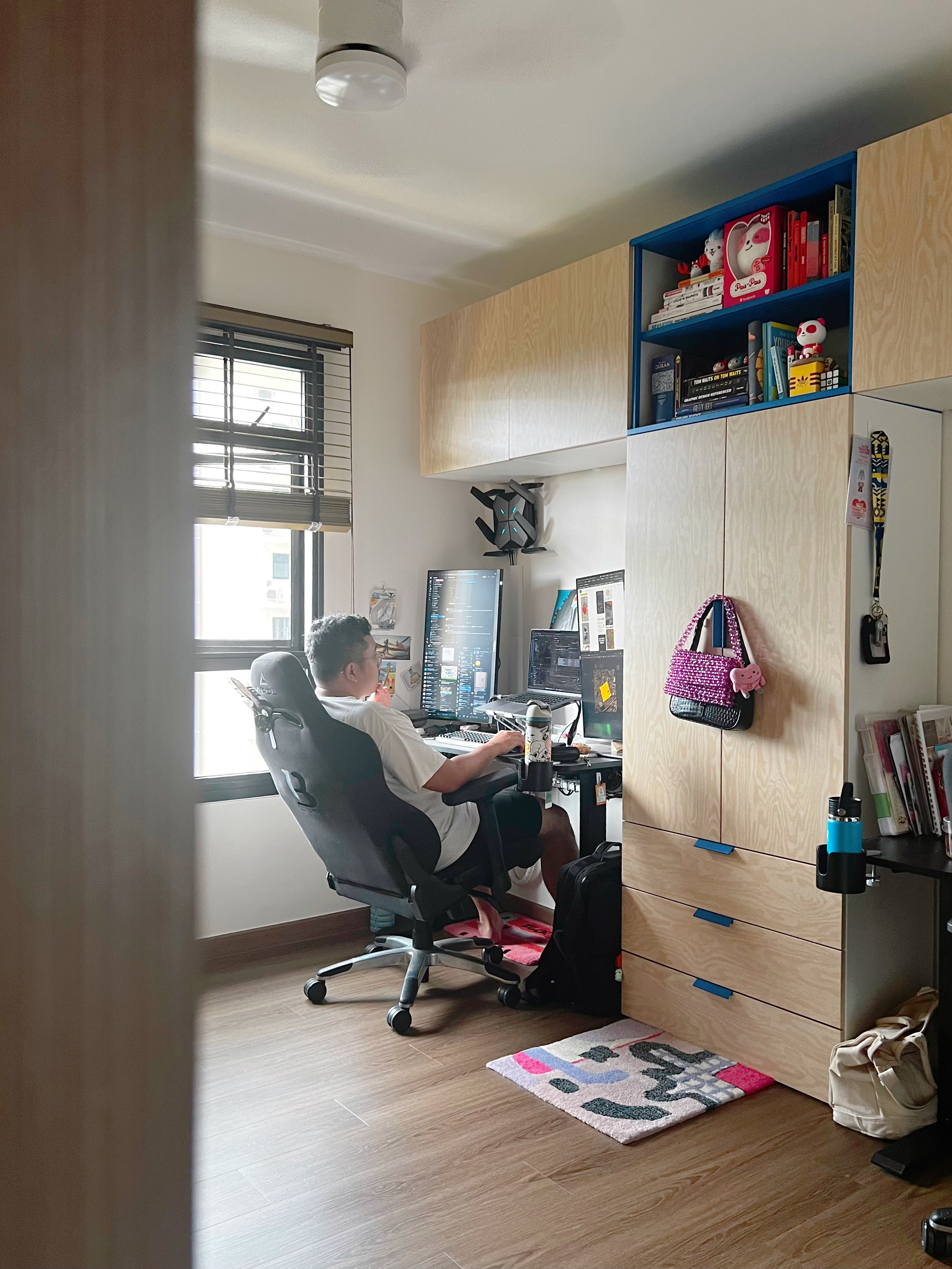 His and Hers WFH set-up - Computer desk, person working, desk lamp, computer monitors, keyboard, mouse, laptop, chair