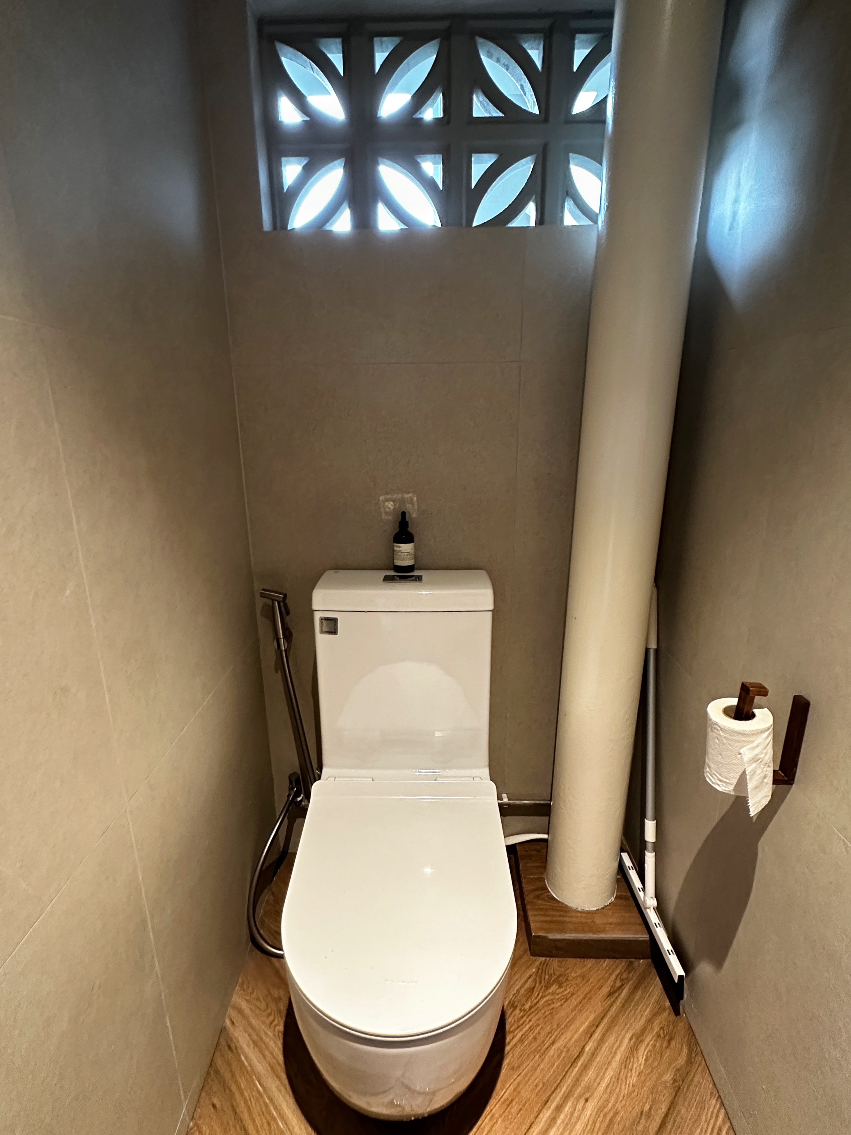 Join us in building our 3 bathrooms! - Modern bathroom, compact space, white toilet, beige walls, wooden floor, natural
