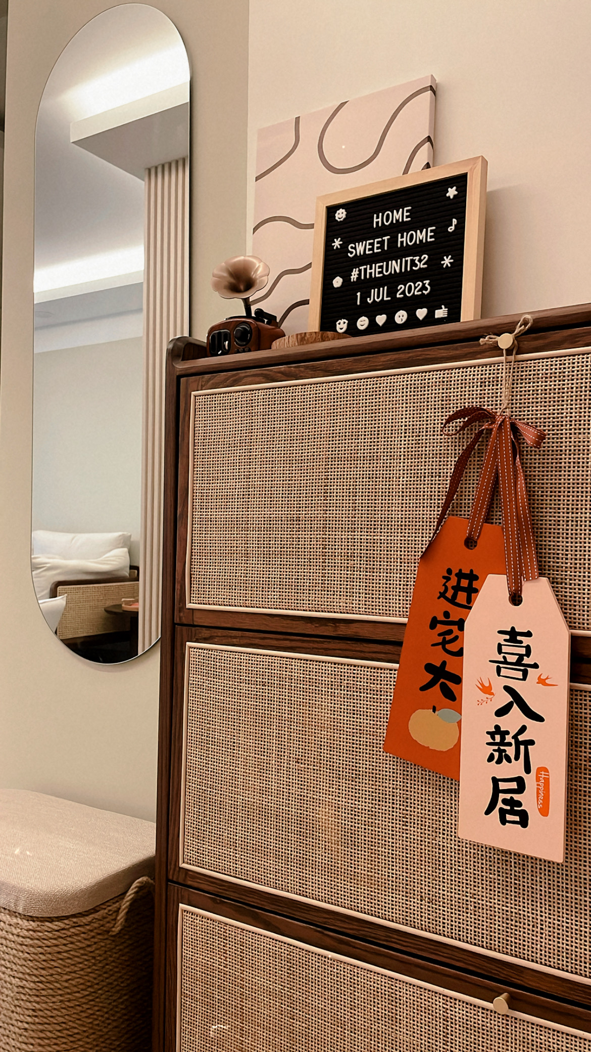 Lovely Entryway into Our Cosy Crib 🏠  - Elegant wooden dresser with woven texture, Vintage-style radio on top of dresser