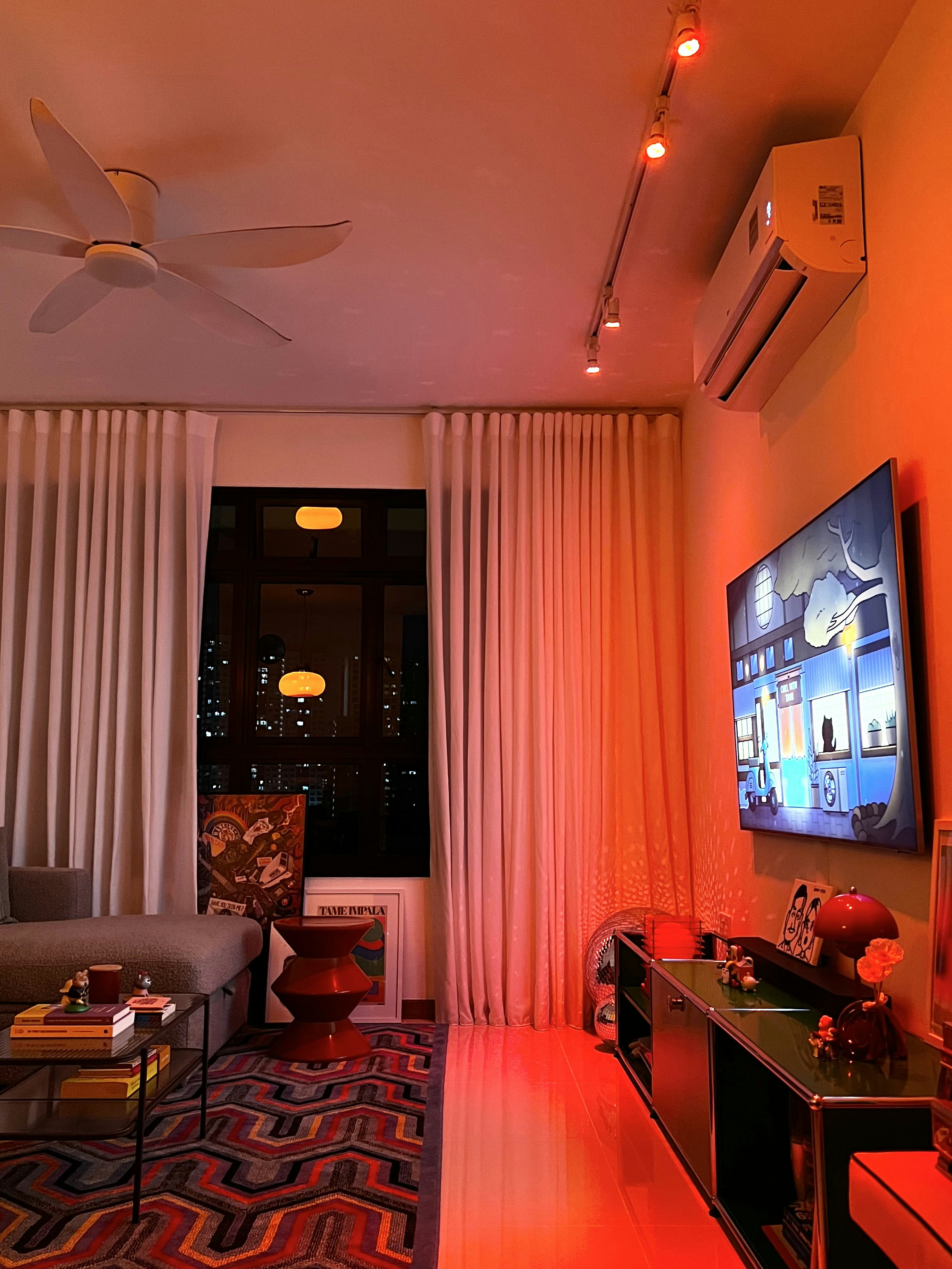 Feeling light-headed about lighting? Here’s some of our favourites. - Modern living room with warm ambiance, ceiling fan