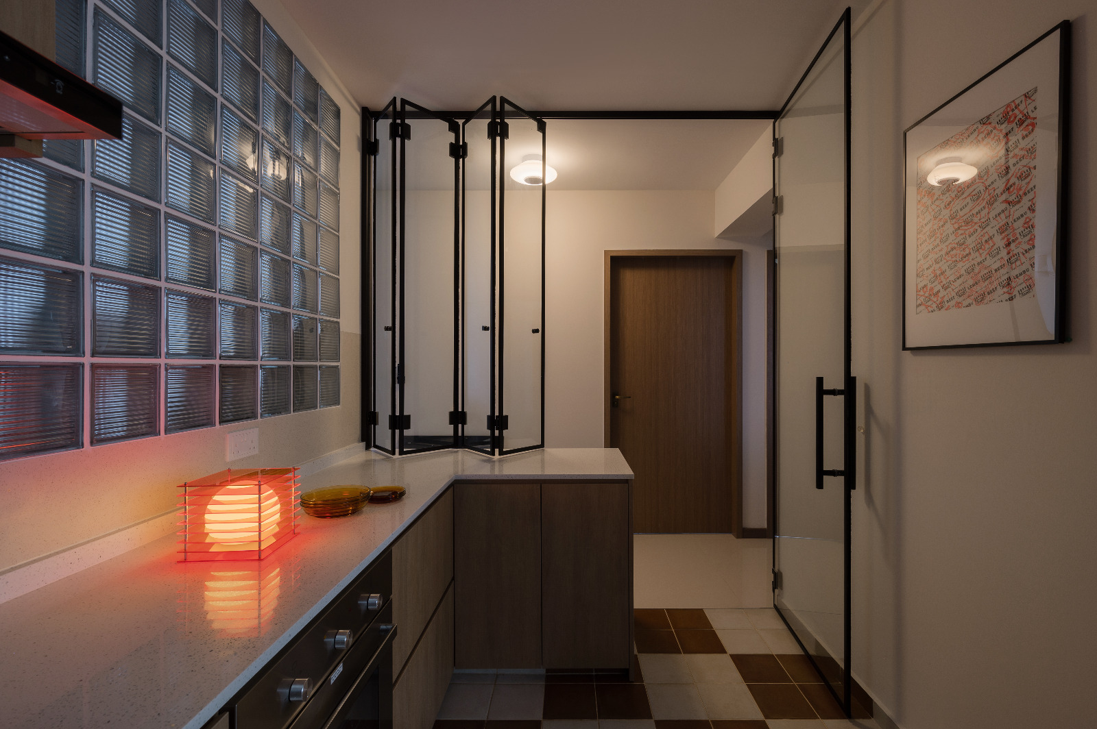 Feeling light-headed about lighting? Here’s some of our favourites. - Modern kitchen with glass shower enclosure, sleek black