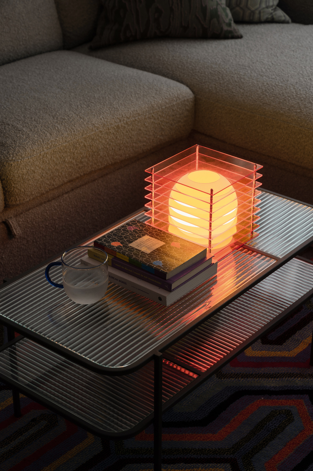 Feeling light-headed about lighting? Here’s some of our favourites. - Modern cozy living room, soft ambient lighting, glass