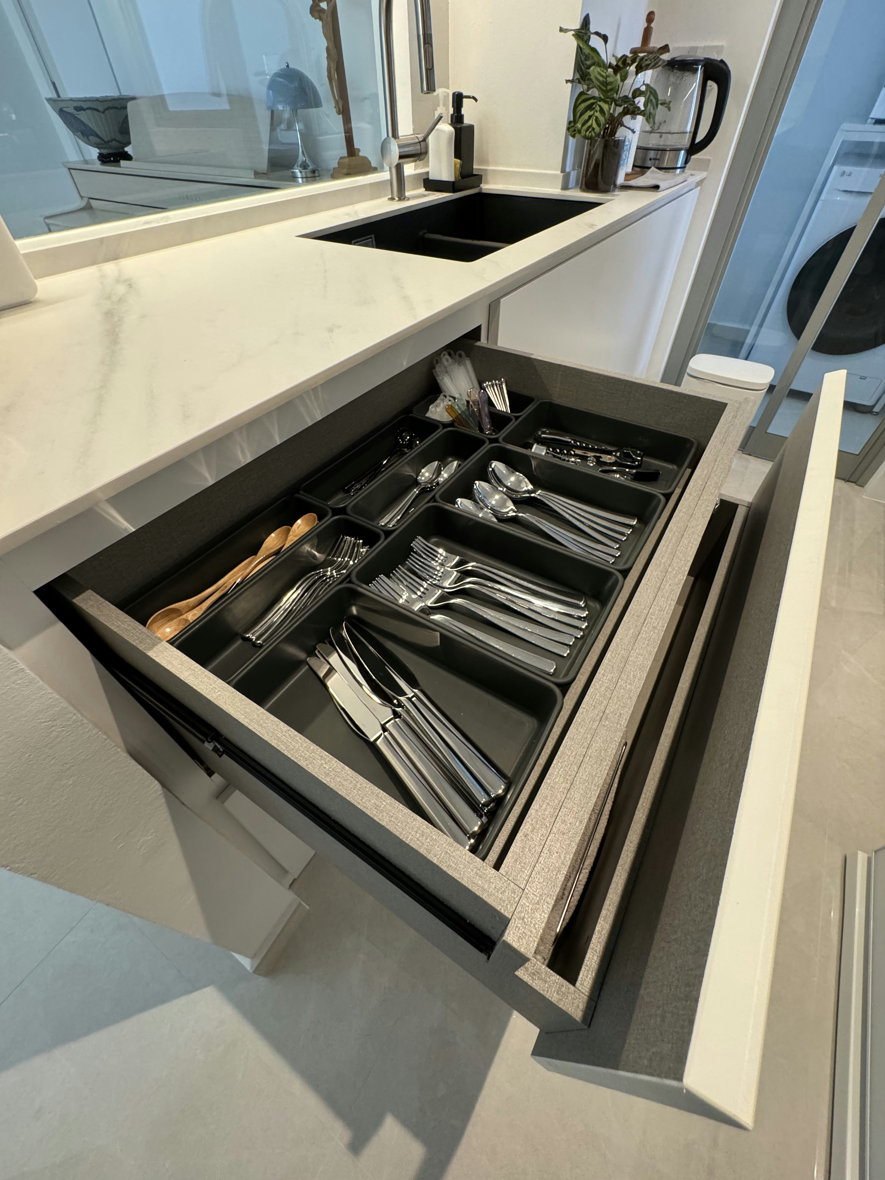 Masak-Masak @ Rumah Beacon - Modern kitchen countertop, sleek black sink, stainless steel faucet, open drawer, neatly