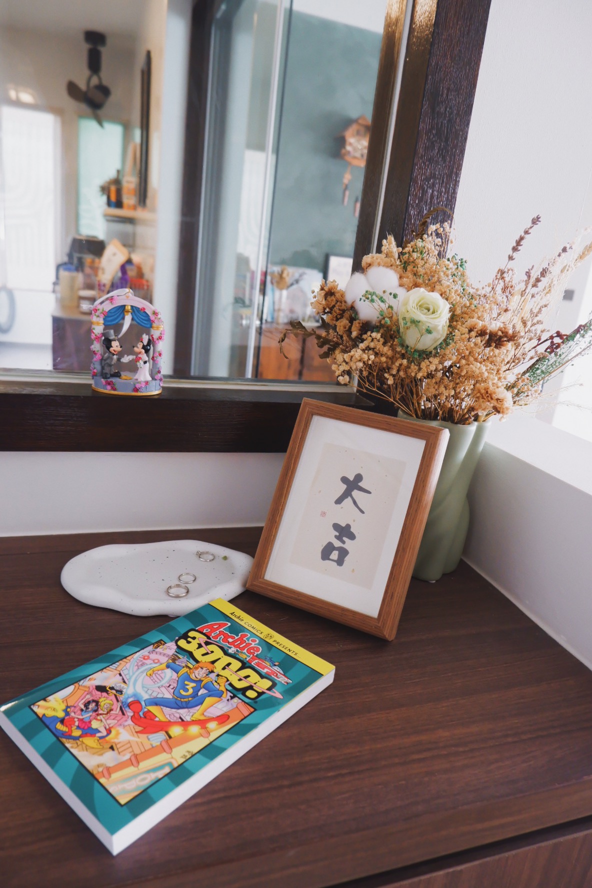Our Entryway: "Hey Siri, I'm home"  - Wooden shelf with decorative items and framed artwork, Japanese calligraphy on a framed