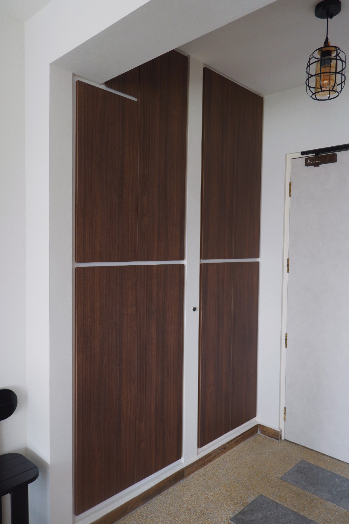 Our Entryway: "Hey Siri, I'm home"  - Wooden wardrobe with metal handles, minimalist design, dark wood paneling, white