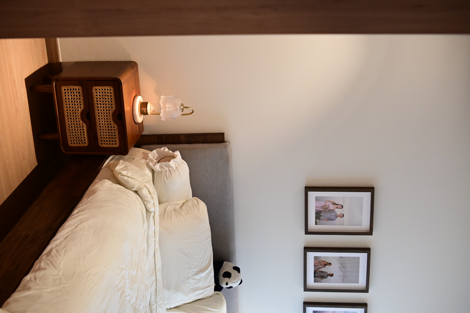 Our bedroom - the most comfortable space in the house  - Wooden nightstand with a lamp, beige bed, white bedding, plush