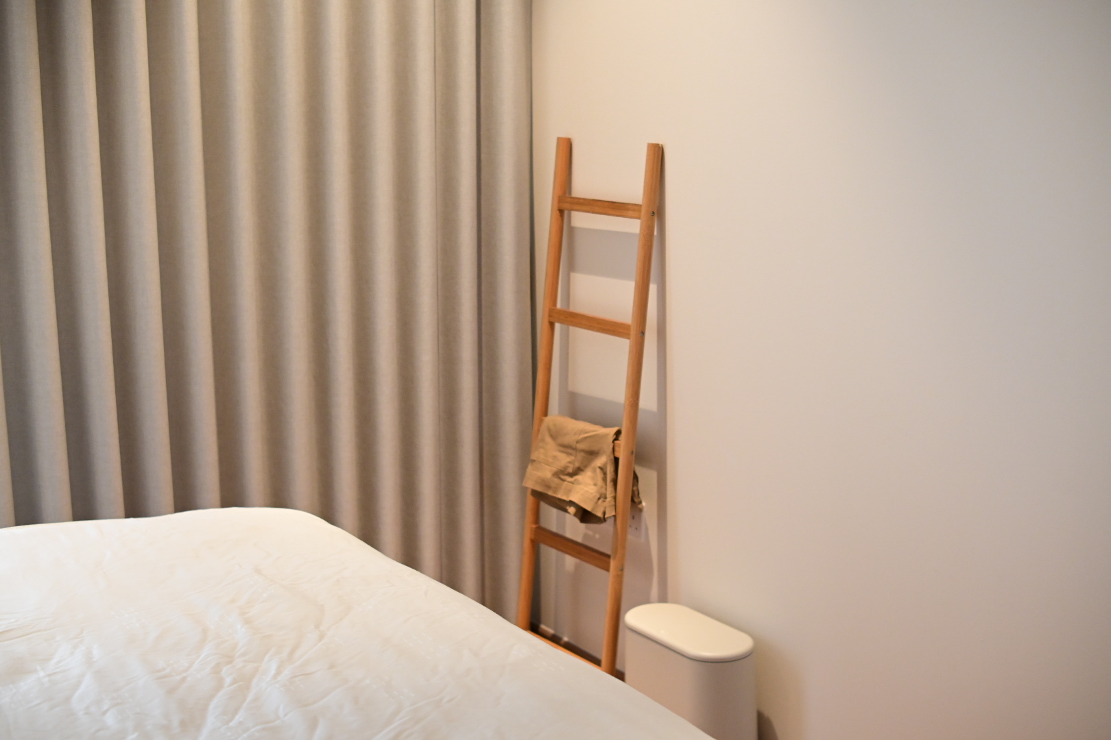Our bedroom - the most comfortable space in the house  - Cream-colored curtains, wooden ladder, beige blanket, white