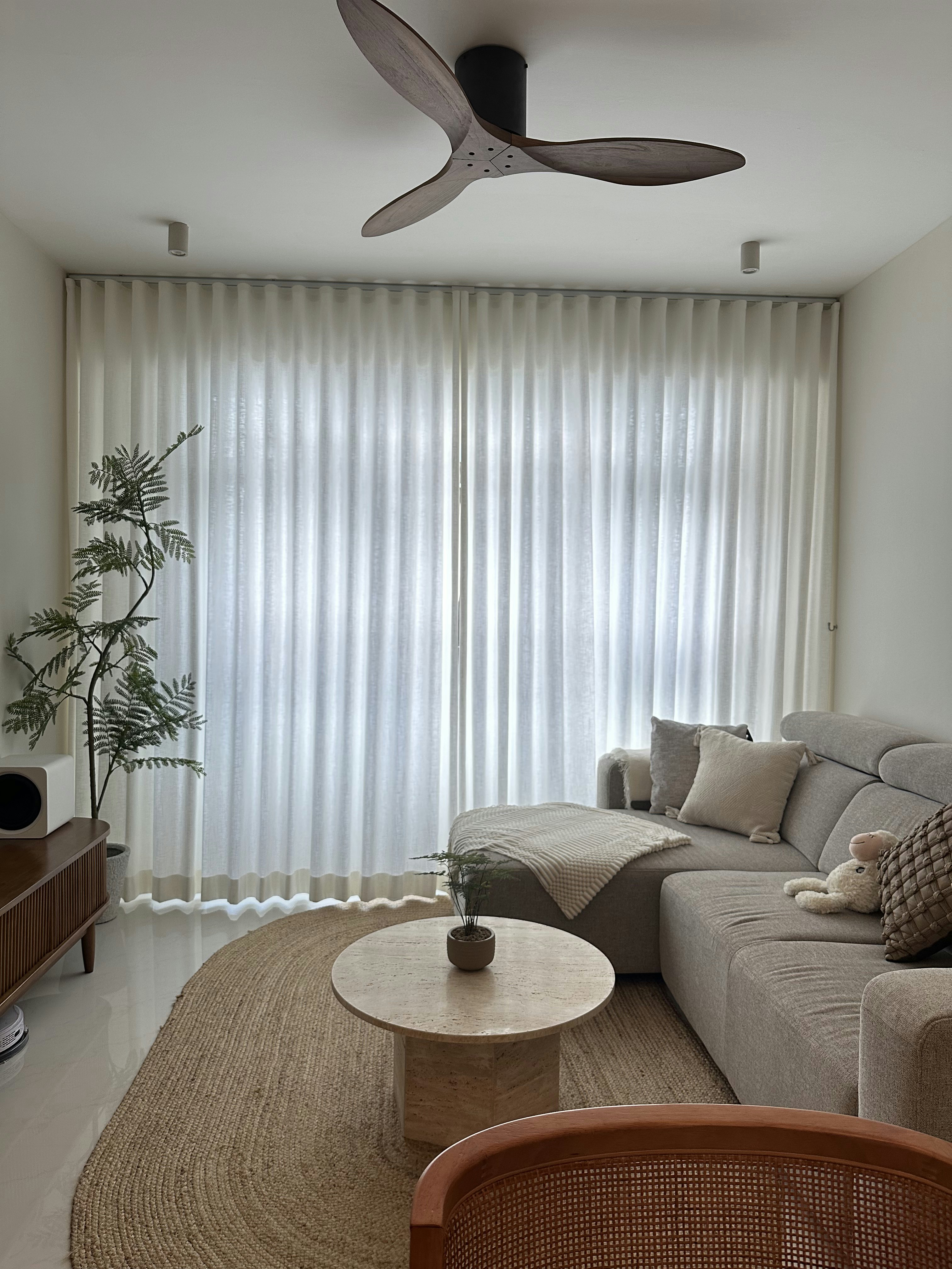 Living room - our fave spot in the house! - Modern living room with beige sofa, light gray cushions, textured rug, wooden