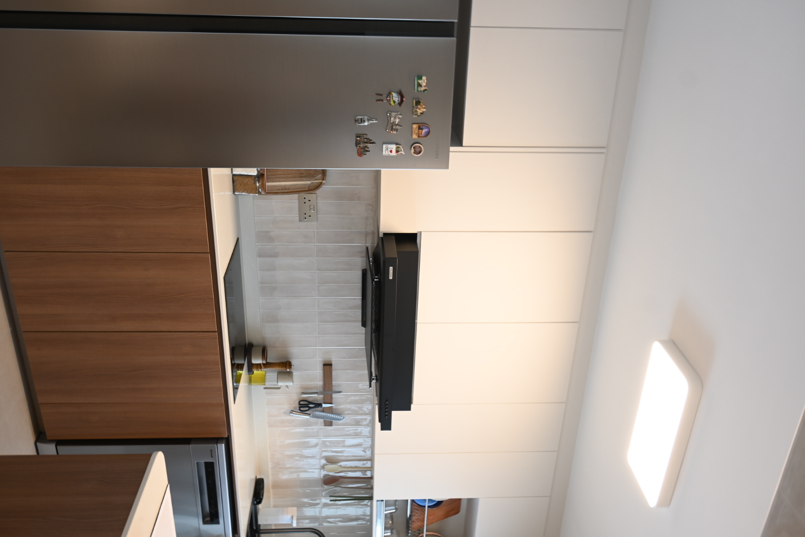 A functional closed kitchen space  - Modern kitchen, stainless steel refrigerator, wooden cabinets, tiled floor, kitchen