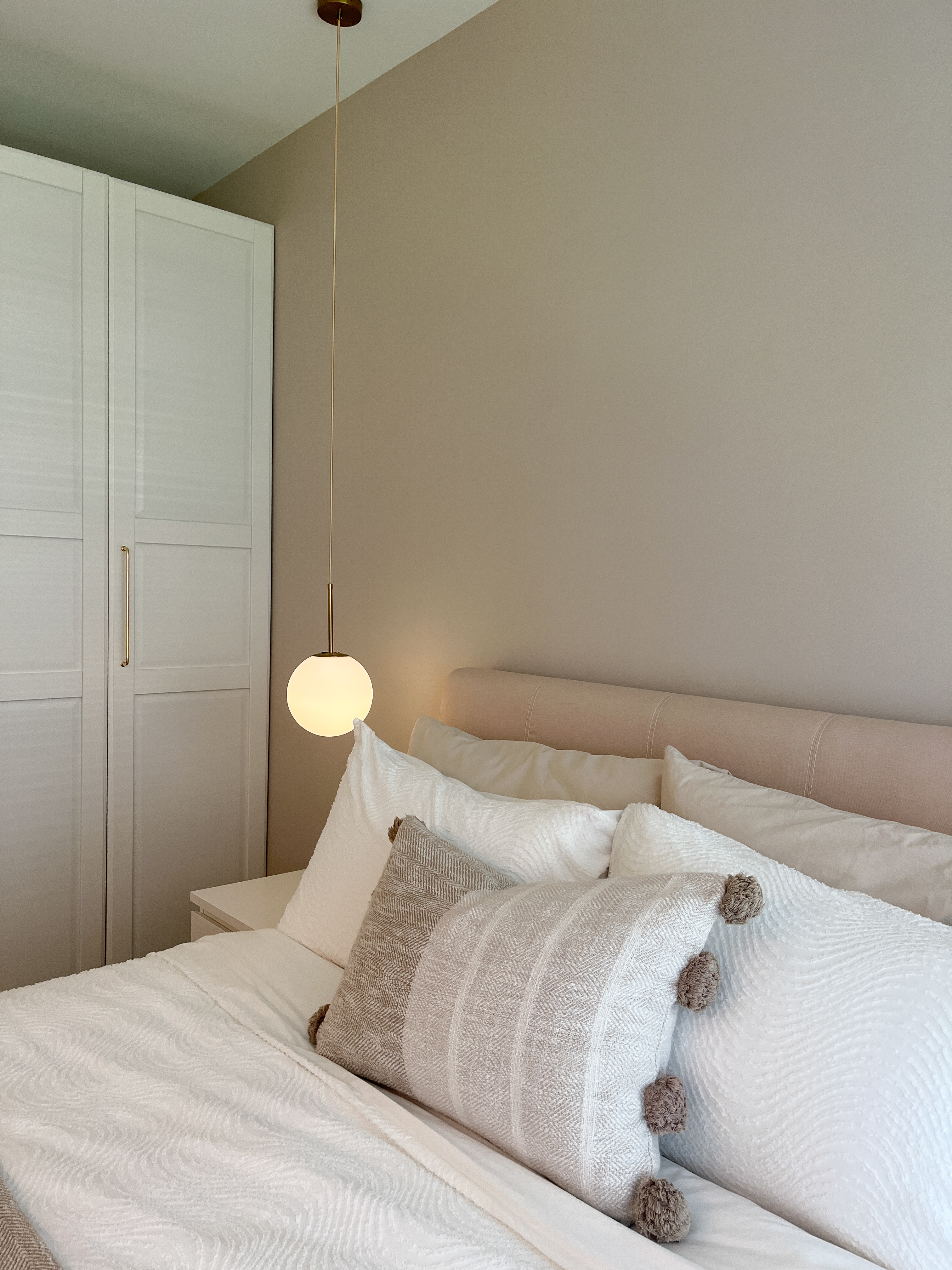 Our Cosy Bedroom to Wind Down & Relax - White and beige bedding, modern pendant light, minimalist decor, soft lighting, cozy