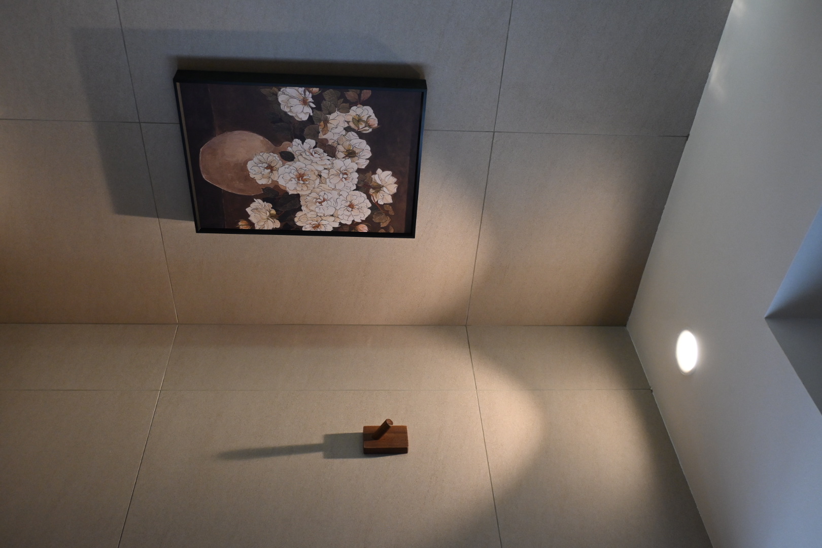 Bali inspired bathrooms  - modern art piece, framed painting, floral arrangement, white flowers, brown background, minimalist