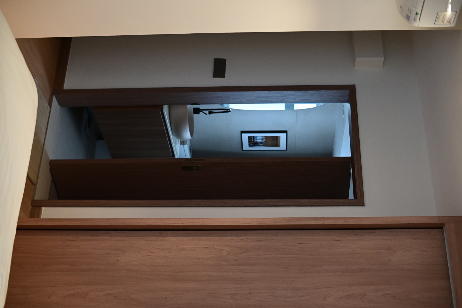 Bali inspired bathrooms  - Wooden staircase, modern design, minimalist decor, sleek cabinetry, open doorway, wooden paneling