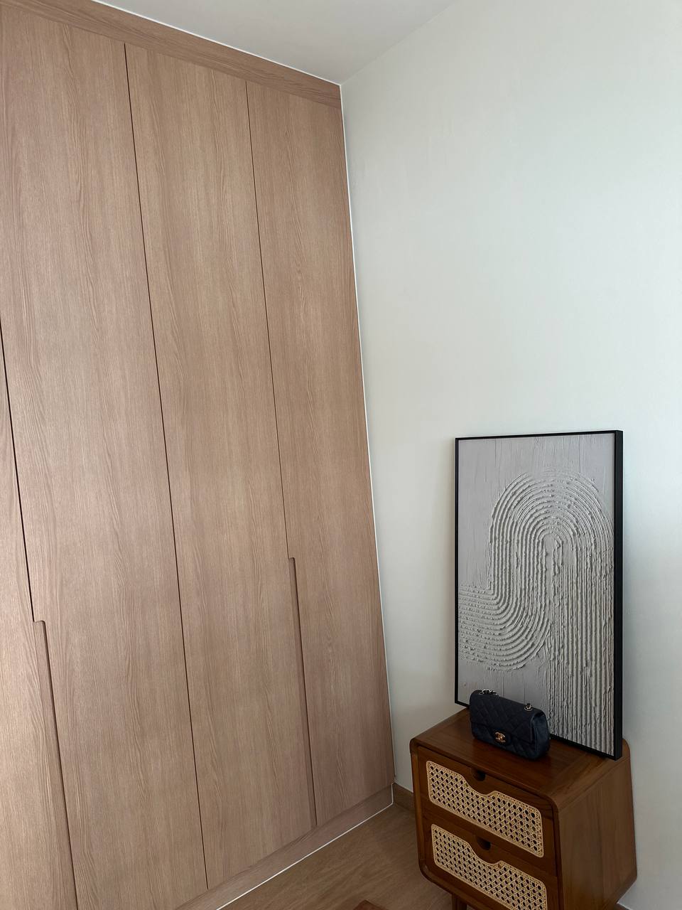 Our clean workspace - Wooden wardrobe, minimalist design, light brown finish, built-in shelving, wooden cabinet, decorative